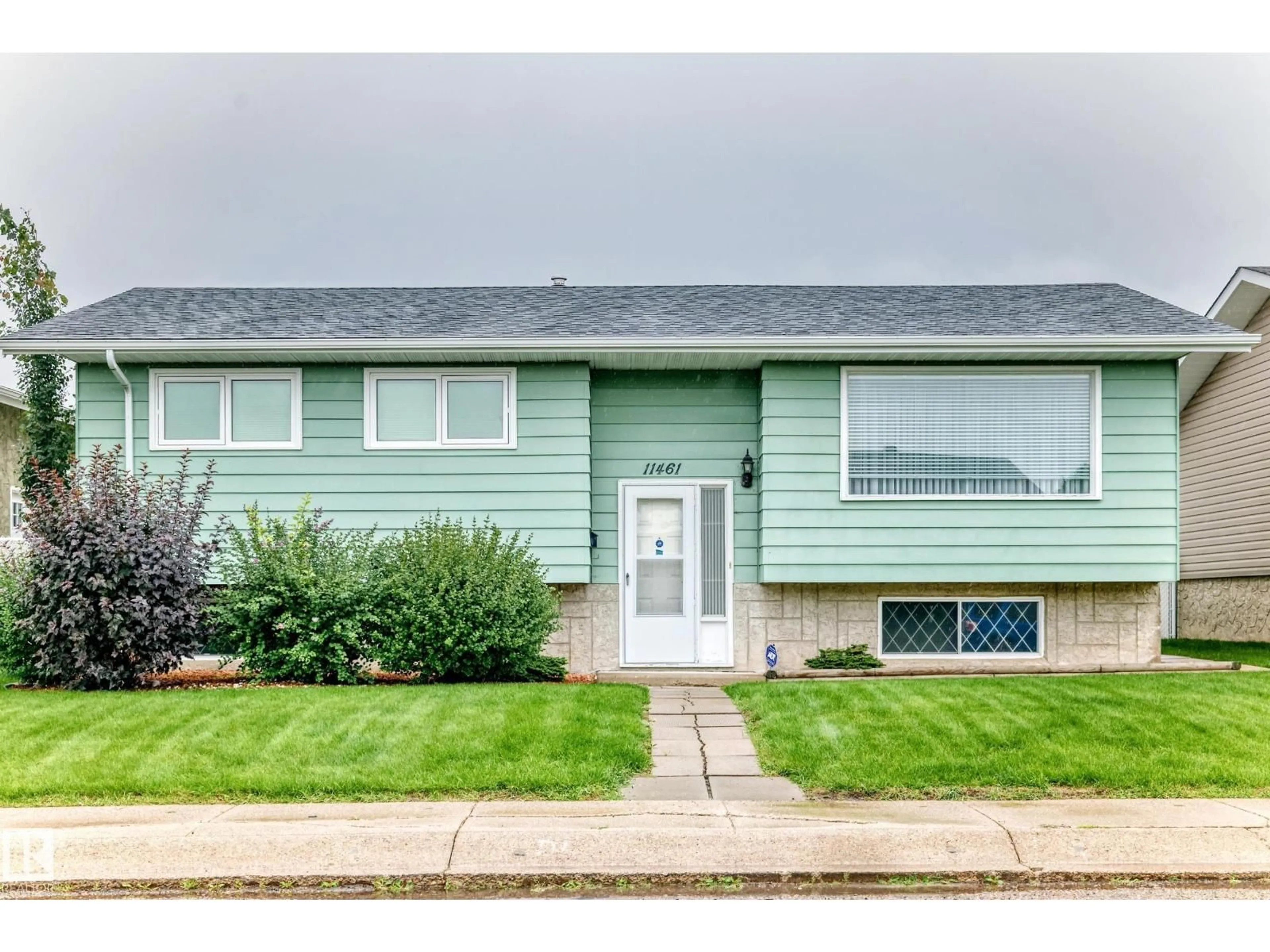 Home with vinyl exterior material, street for 11461 152A AV, Edmonton Alberta T5X1E3
