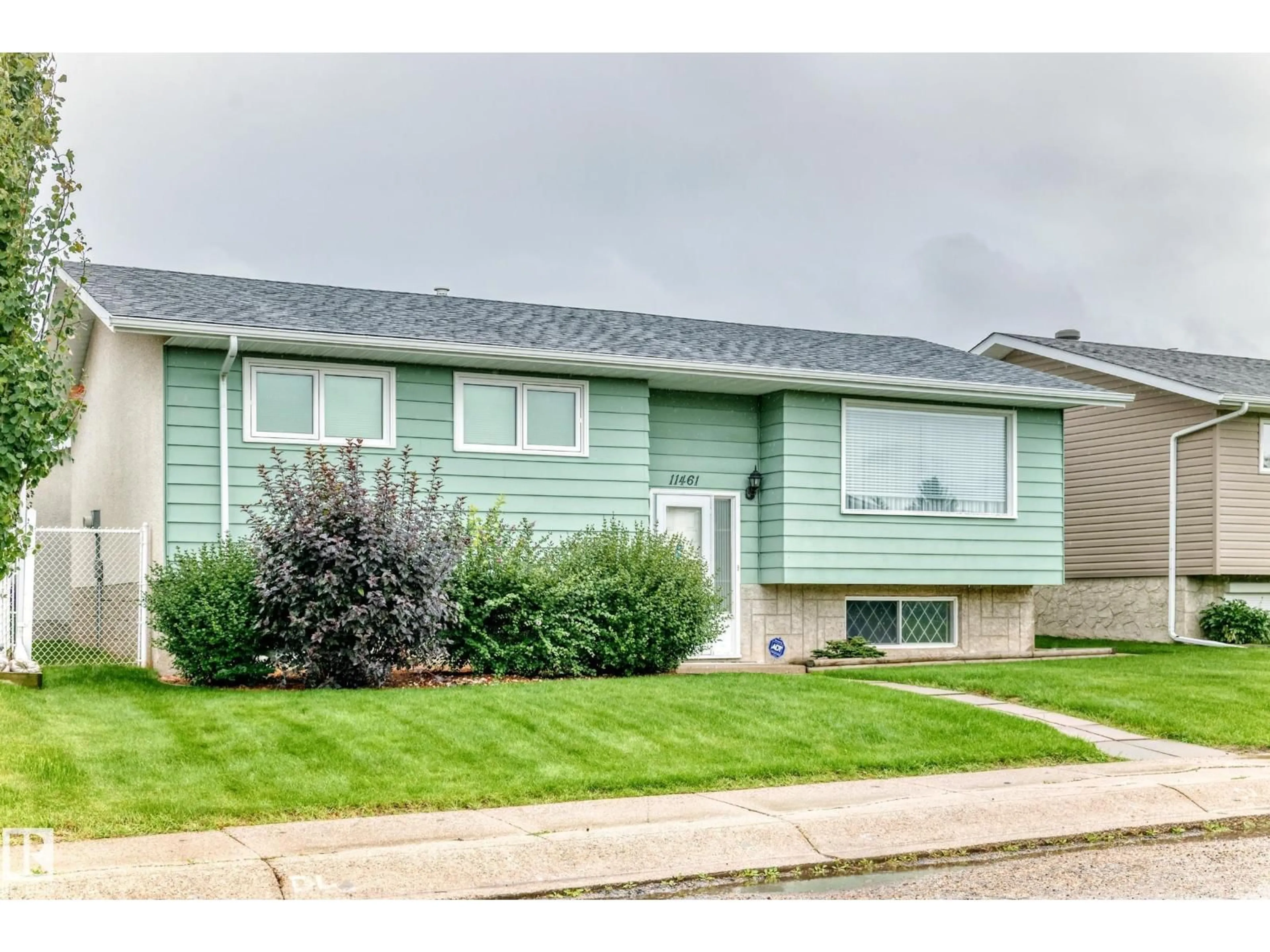 Home with vinyl exterior material, street for 11461 152A AV, Edmonton Alberta T5X1E3