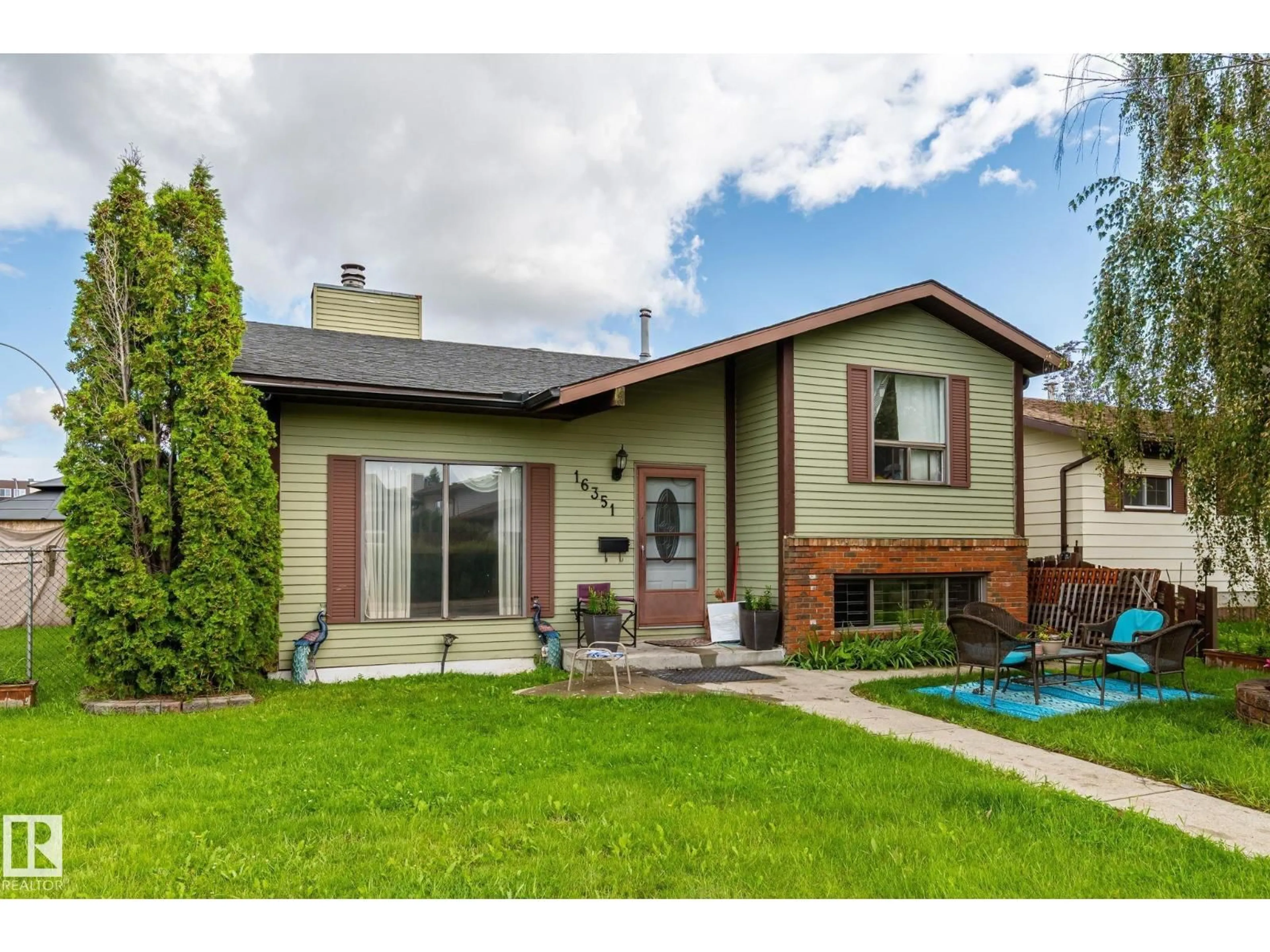 Home with vinyl exterior material, street for NW - 16351 119 ST, Edmonton Alberta T5X4Z3