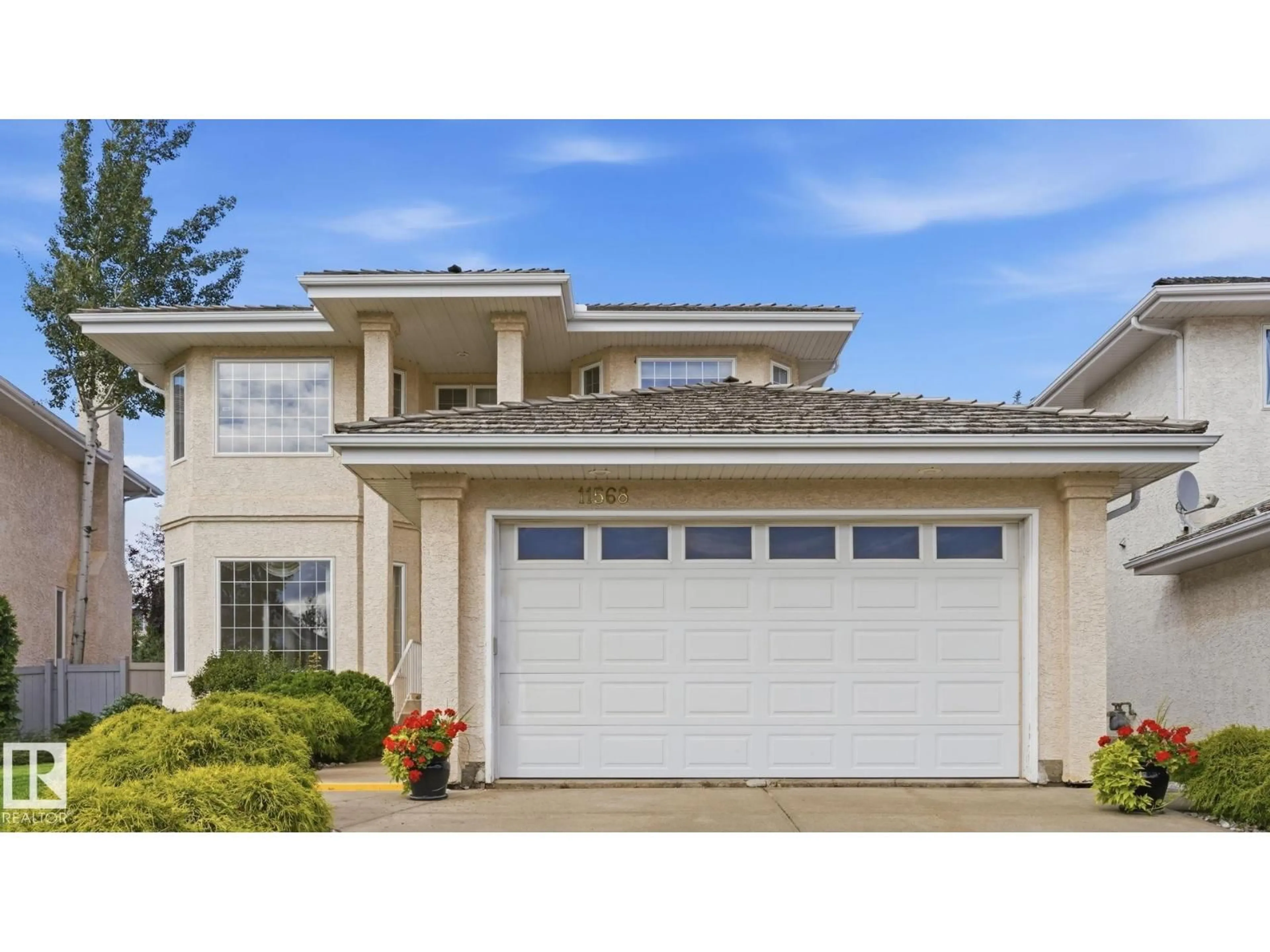 Home with vinyl exterior material, street for 11568 15 AV, Edmonton Alberta T6J7C9