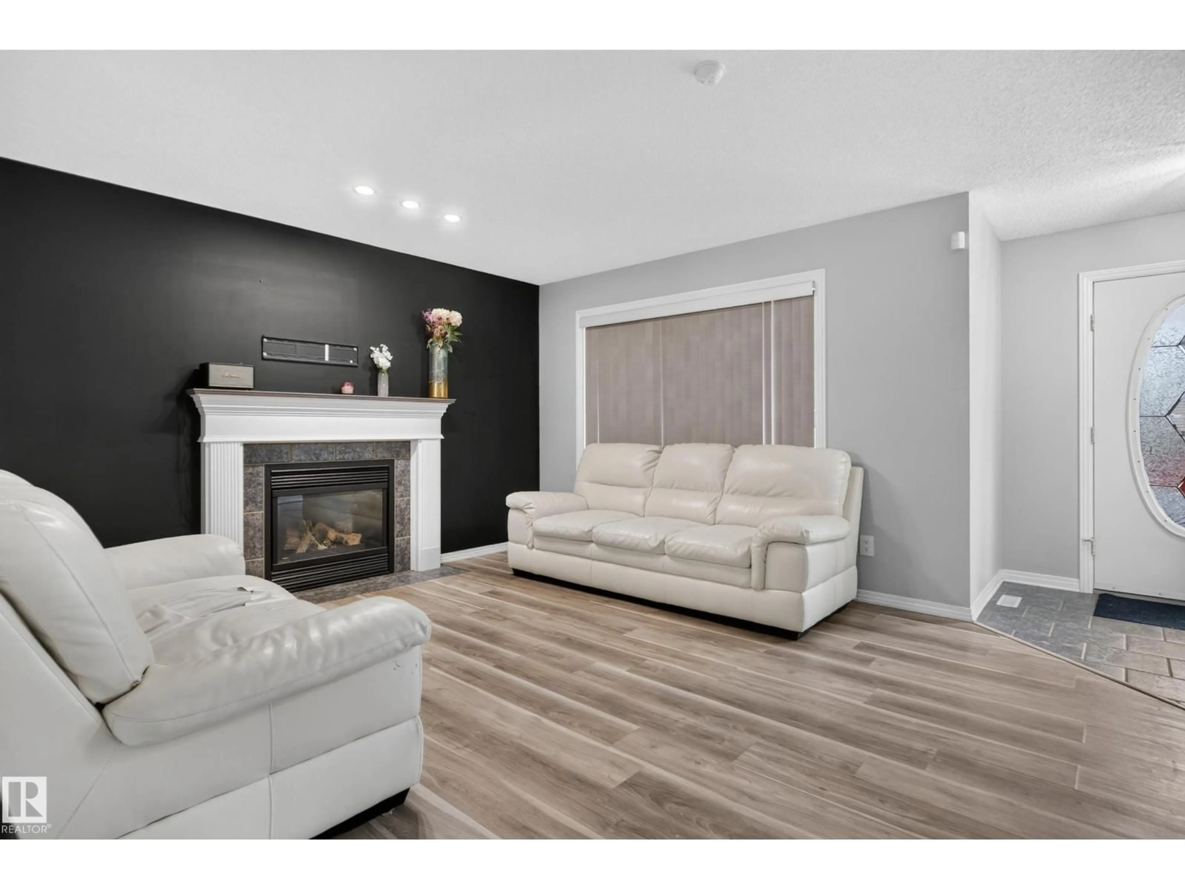 Living room with furniture, wood/laminate floor for NW - 3755 20 ST, Edmonton Alberta T6T1R8