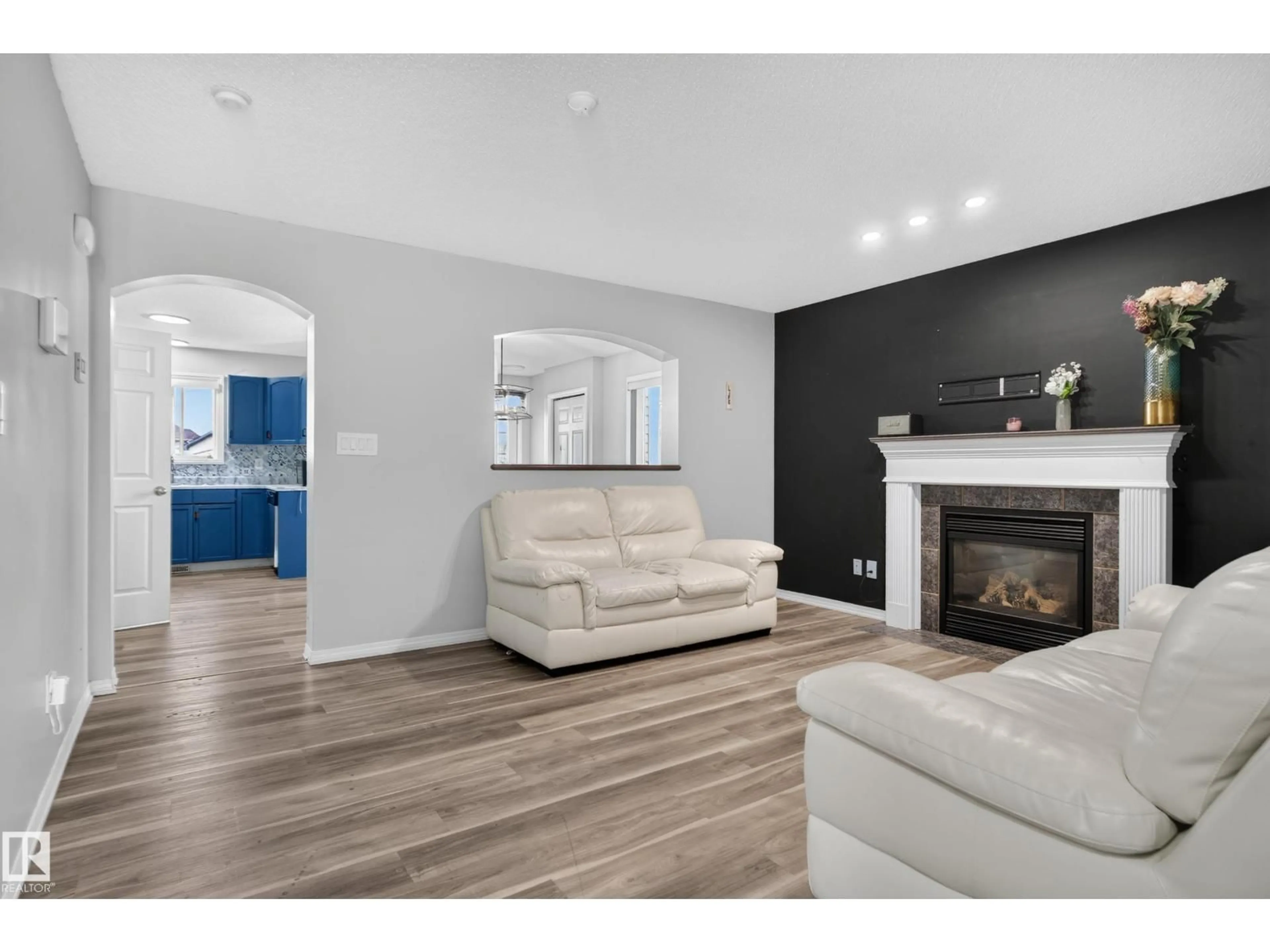 Living room with furniture, wood/laminate floor for NW - 3755 20 ST, Edmonton Alberta T6T1R8