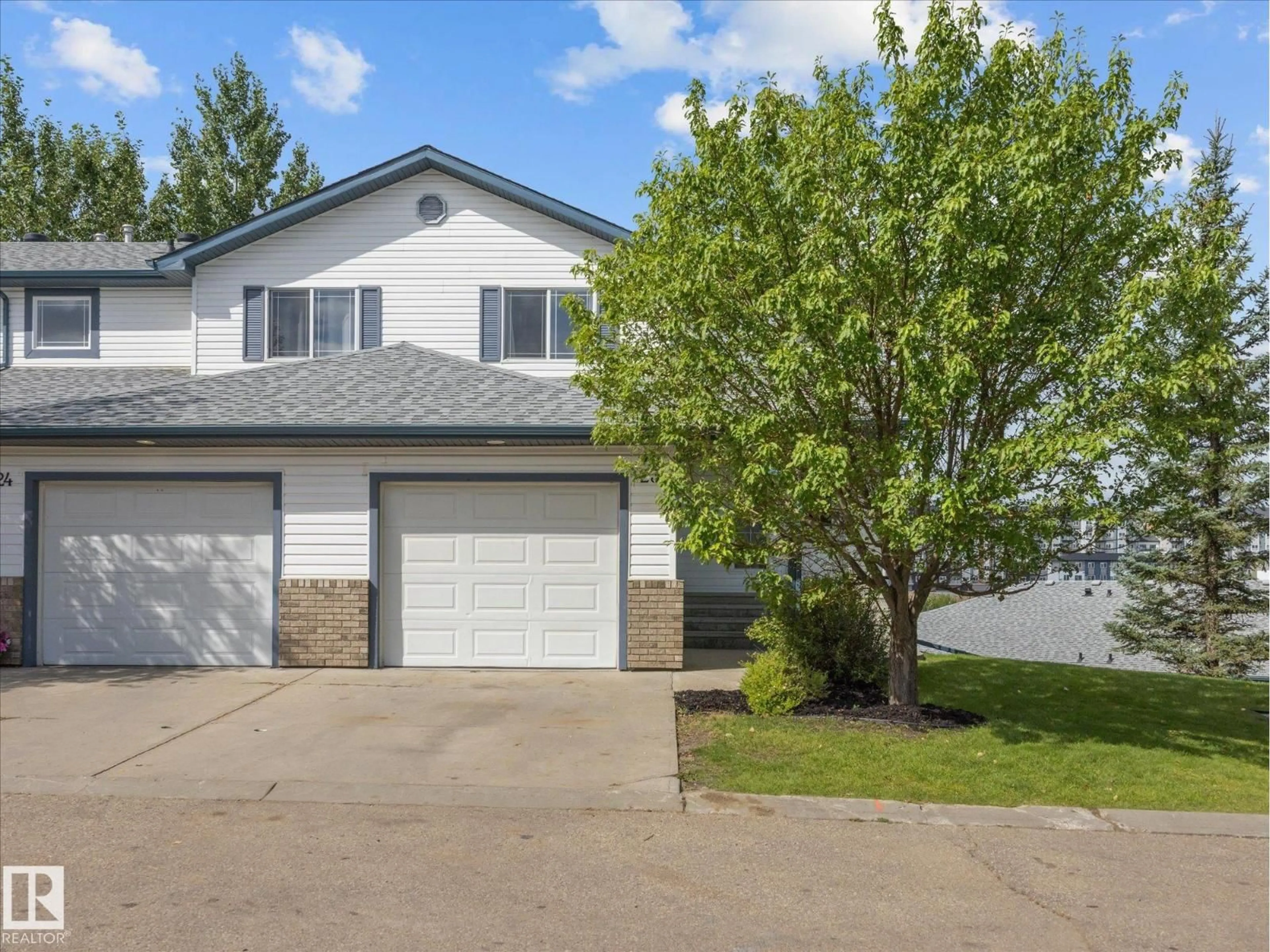 Home with vinyl exterior material, street for #23 - 450 HYNDMAN CR, Edmonton Alberta T5A0E2