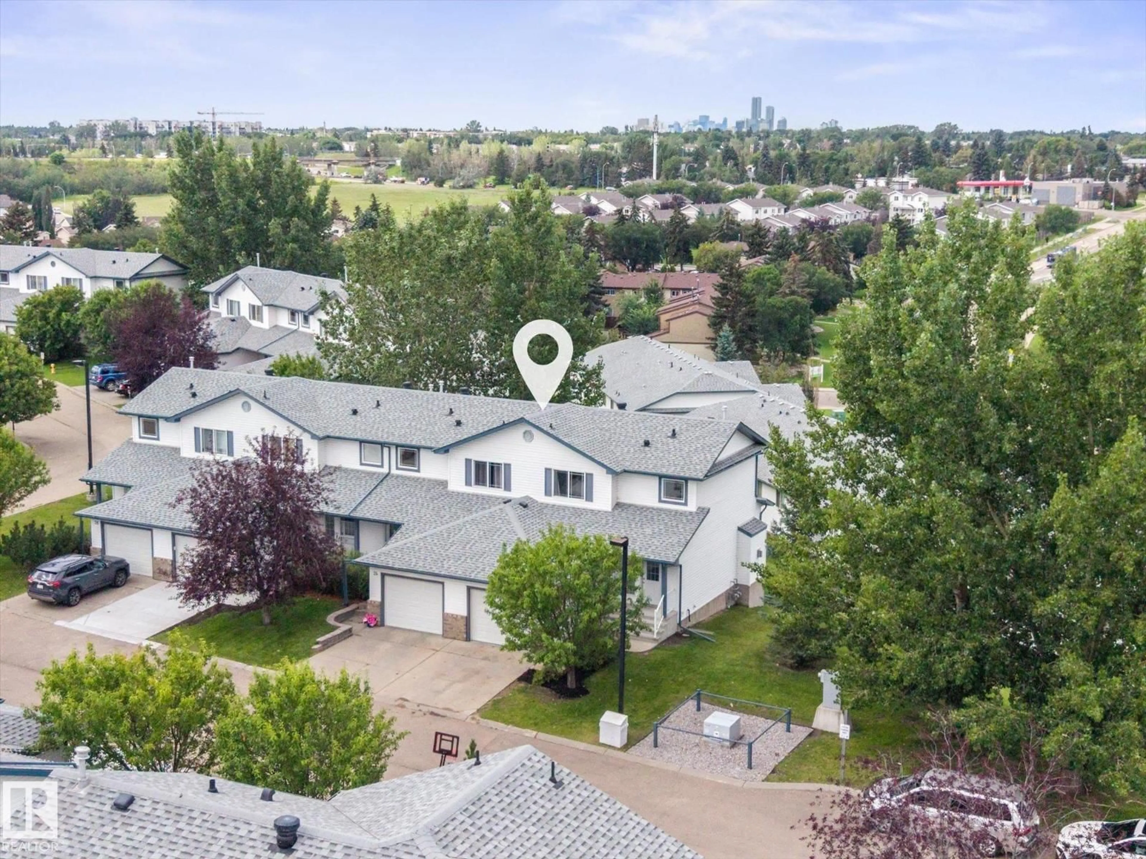 A pic from outside/outdoor area/front of a property/back of a property/a pic from drone, mountain view for #23 - 450 HYNDMAN CR, Edmonton Alberta T5A0E2