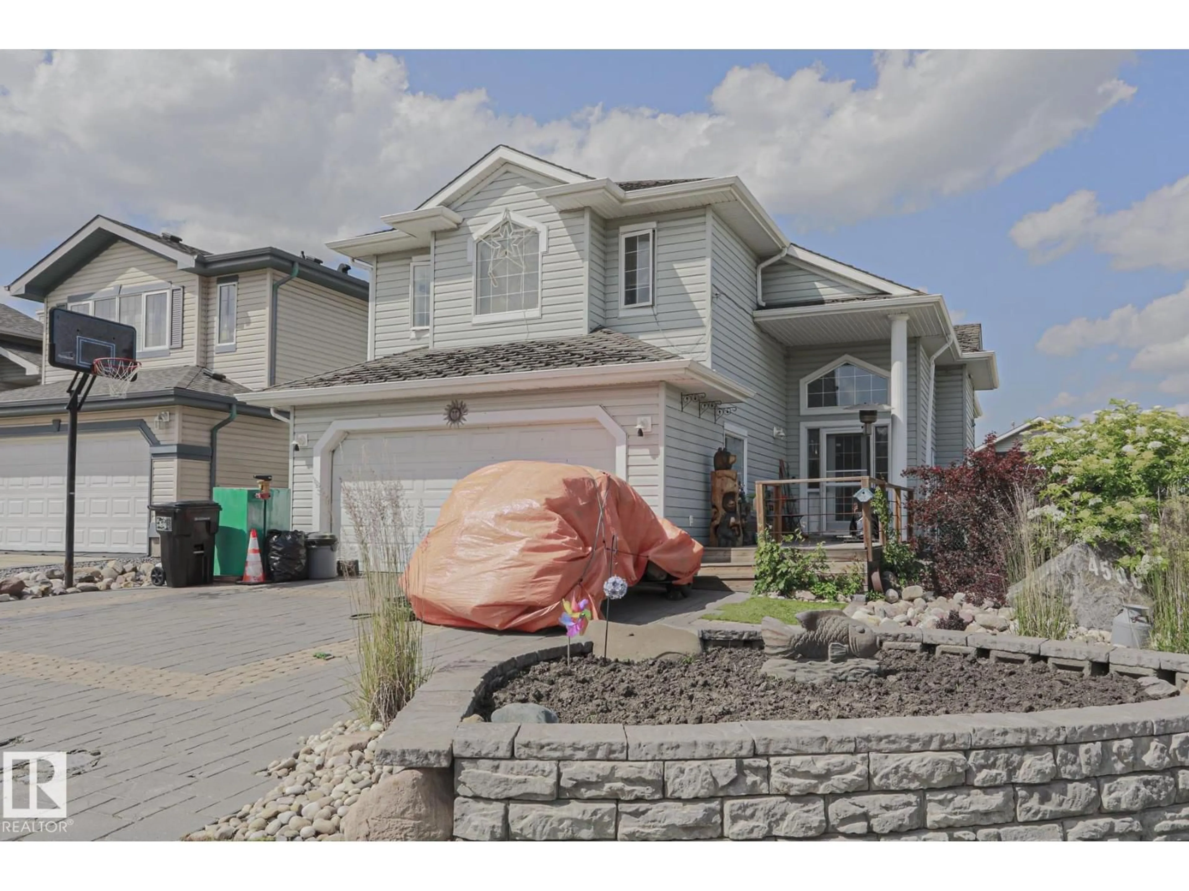 Home with vinyl exterior material, street for NW - 4506 154 AV, Edmonton Alberta T5Y3H3