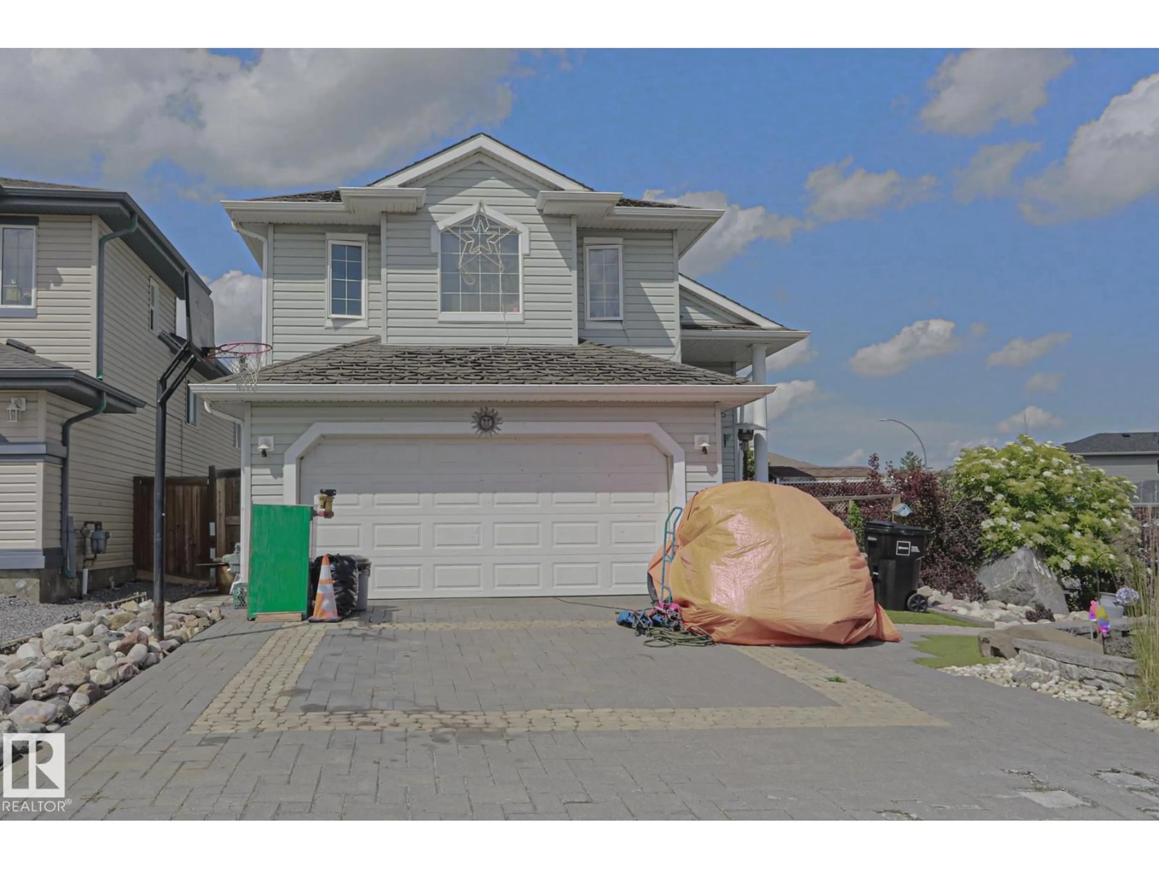 Home with vinyl exterior material, street for NW - 4506 154 AV, Edmonton Alberta T5Y3H3