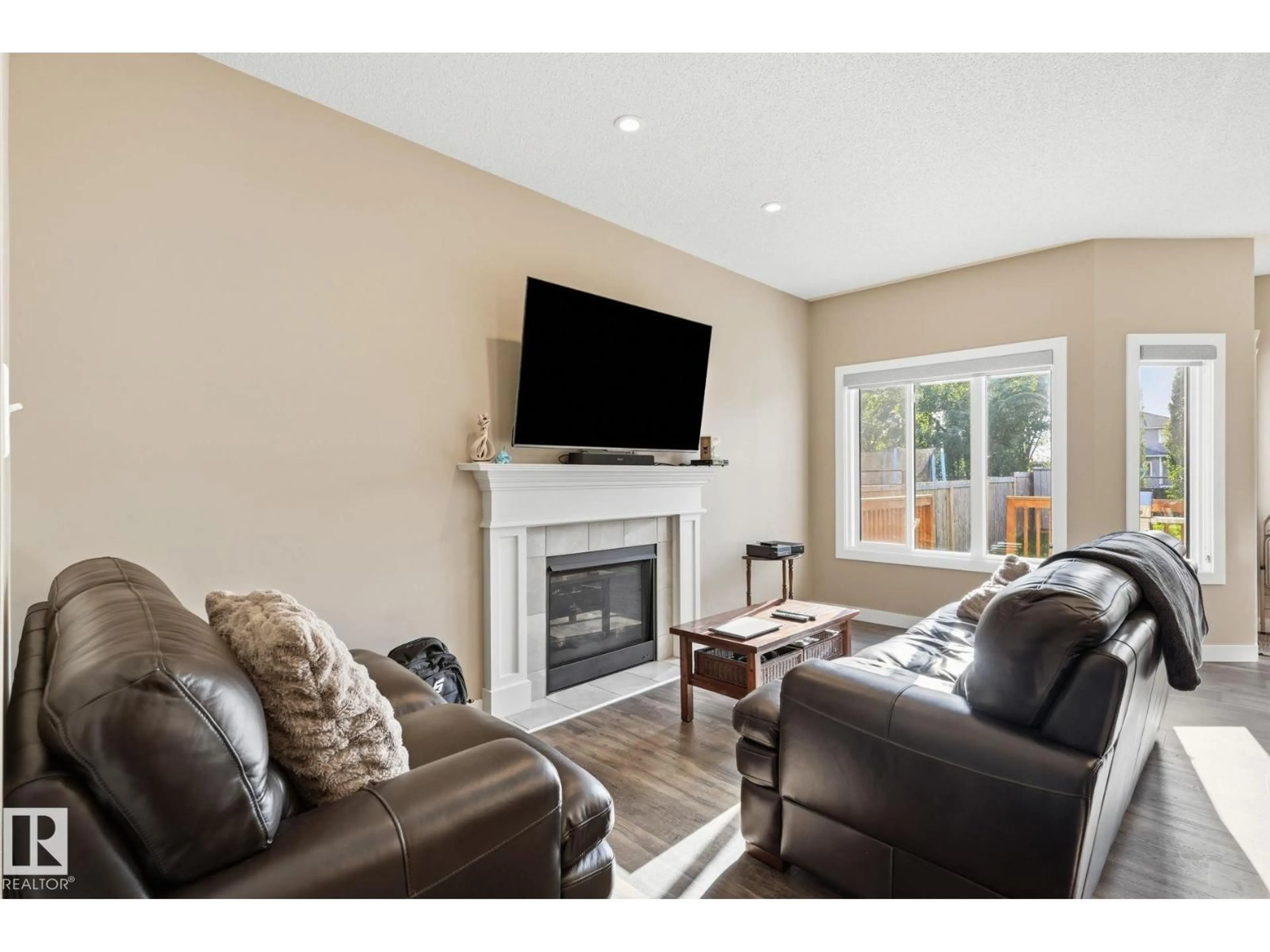 Living room with furniture, wood/laminate floor for 38 DURRAND BN, Fort Saskatchewan Alberta T8L0N1