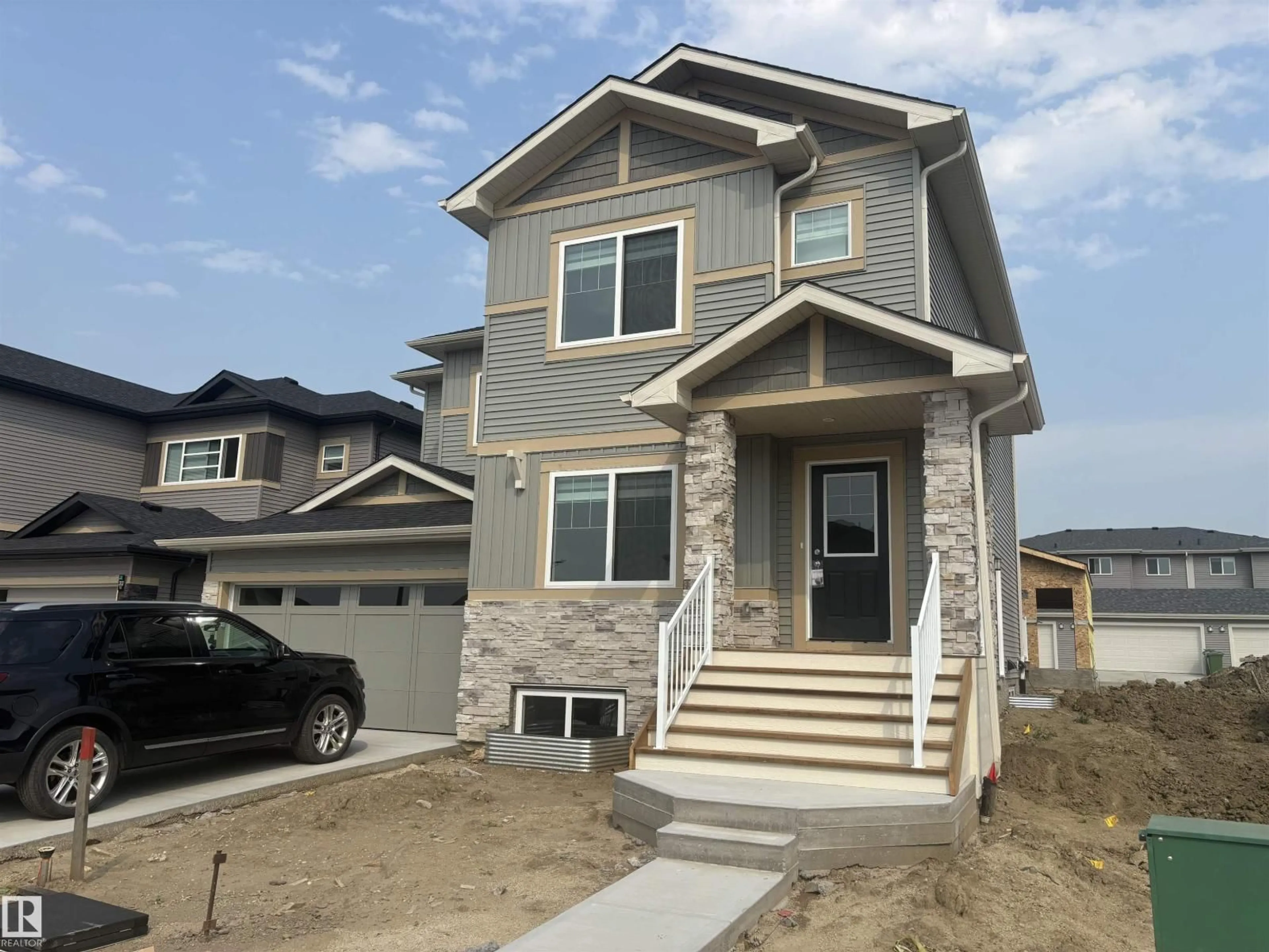 Home with vinyl exterior material, street for 307 BRAE WY, Leduc Alberta T9E1T7