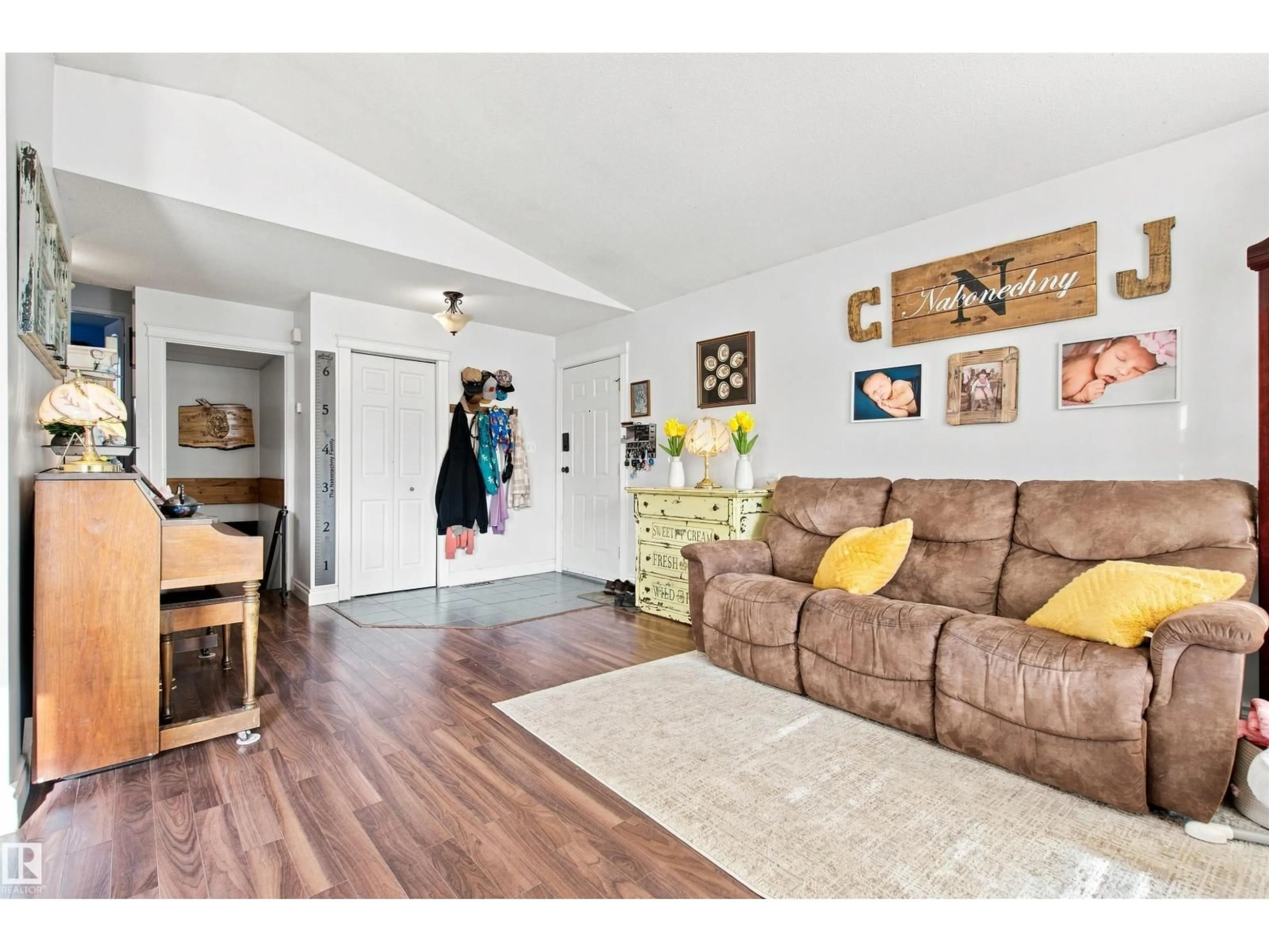 Living room with furniture, wood/laminate floor for 301 22 ST, Cold Lake Alberta T9M1E8