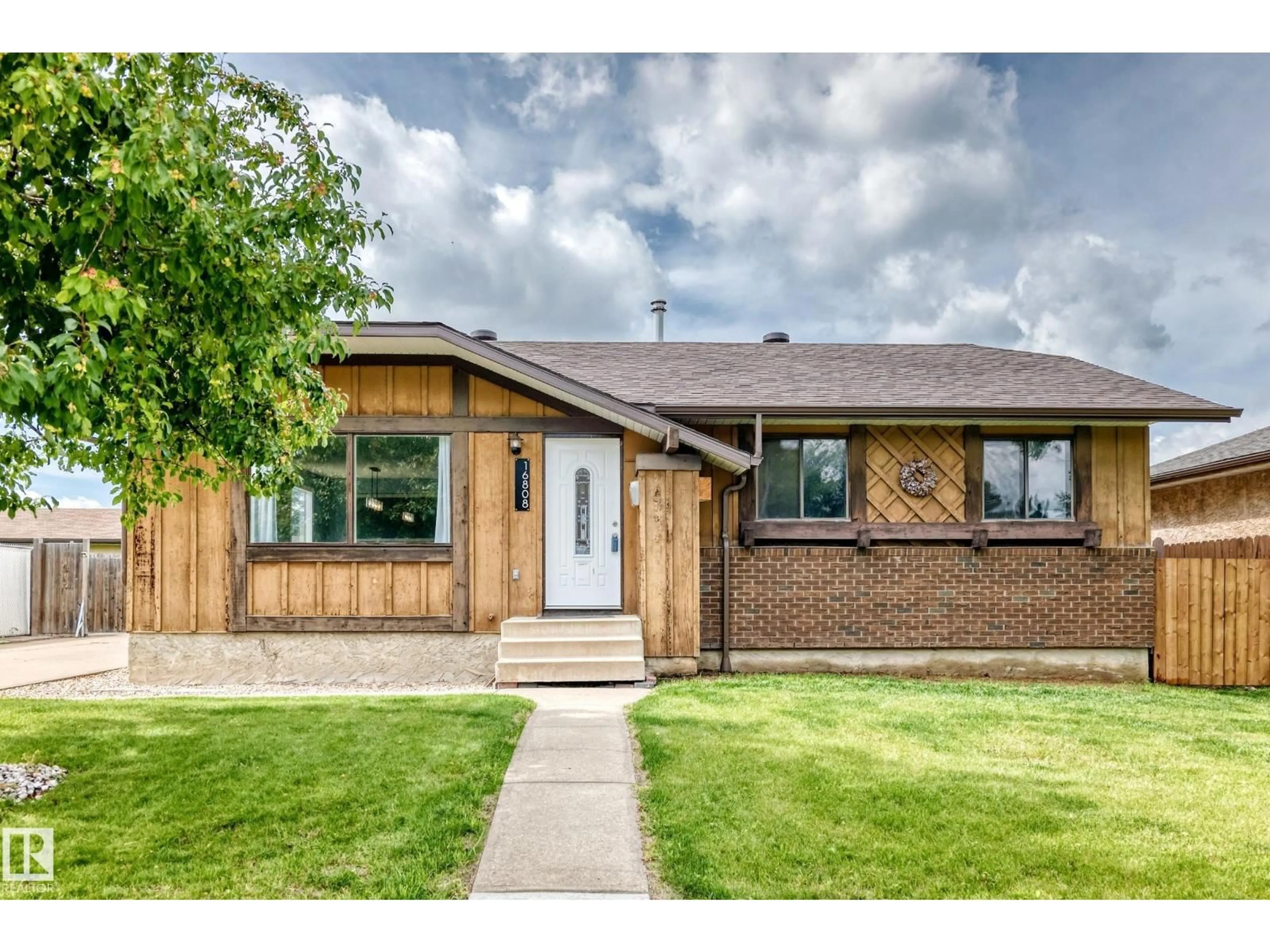 Home with brick exterior material, street for NW - 16808 100 ST, Edmonton Alberta T5X4L6
