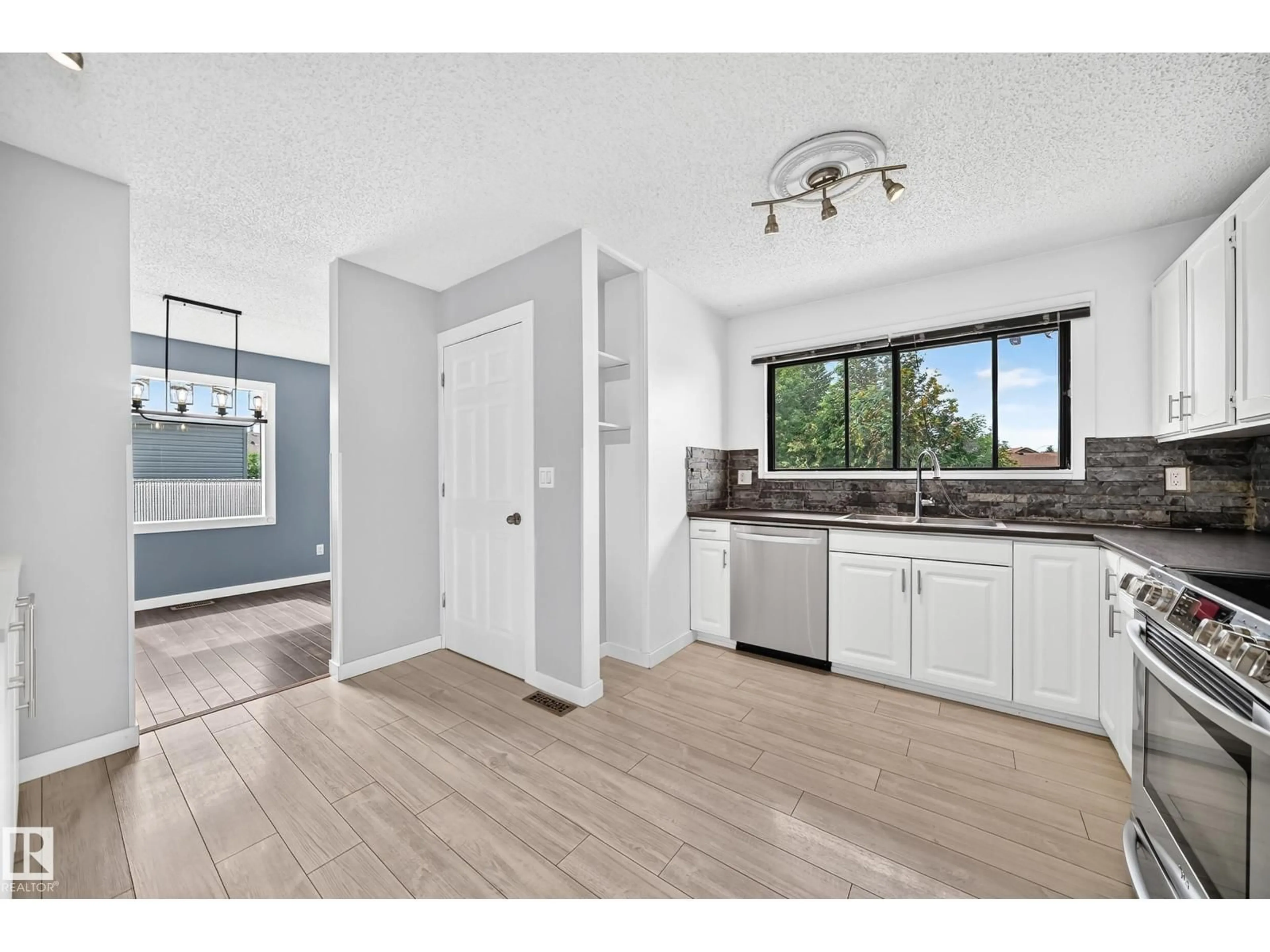Open concept kitchen, unknown for NW - 16808 100 ST, Edmonton Alberta T5X4L6