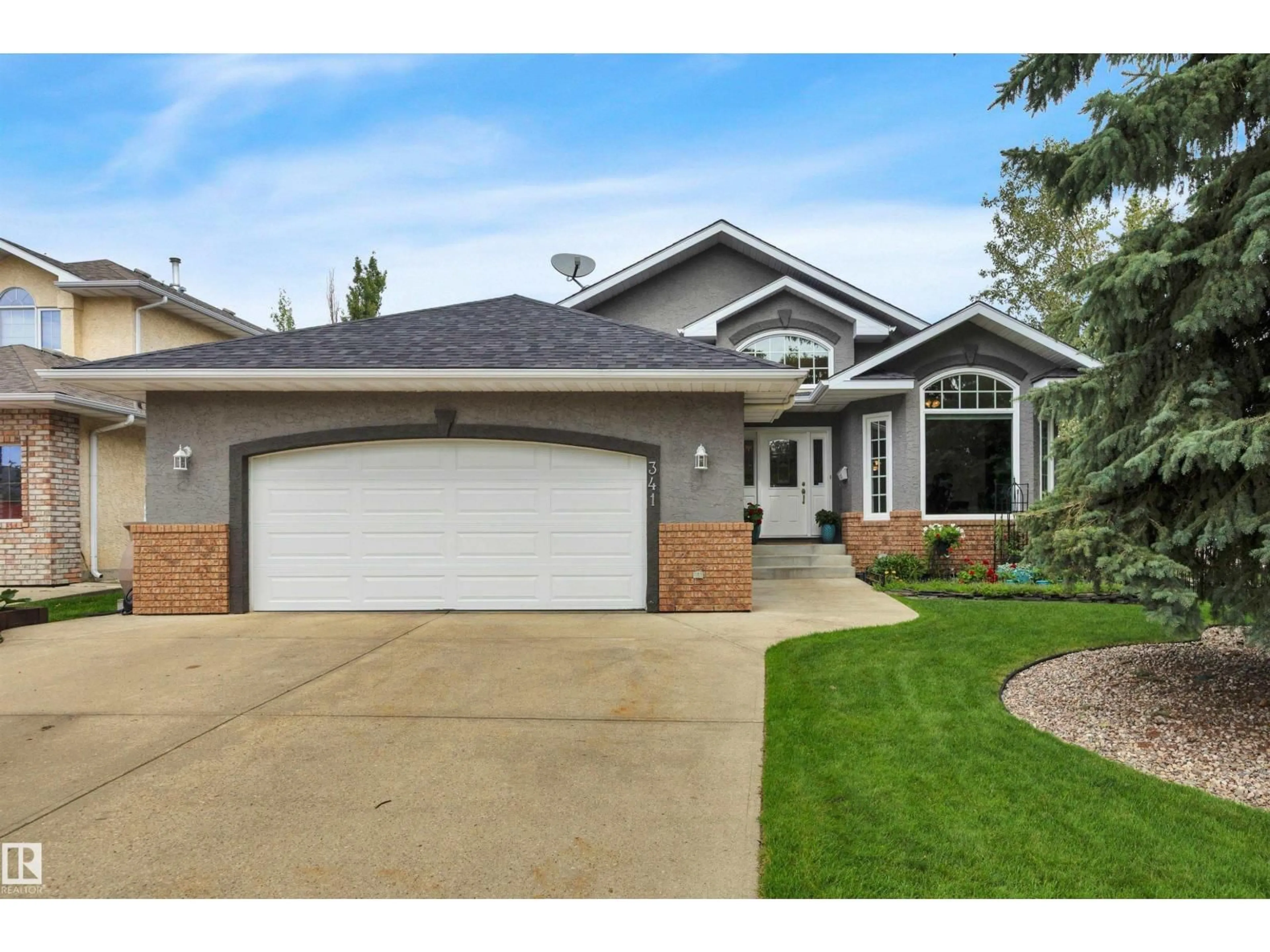 Home with vinyl exterior material, street for 341 BURTON RD, Edmonton Alberta T6R2J1