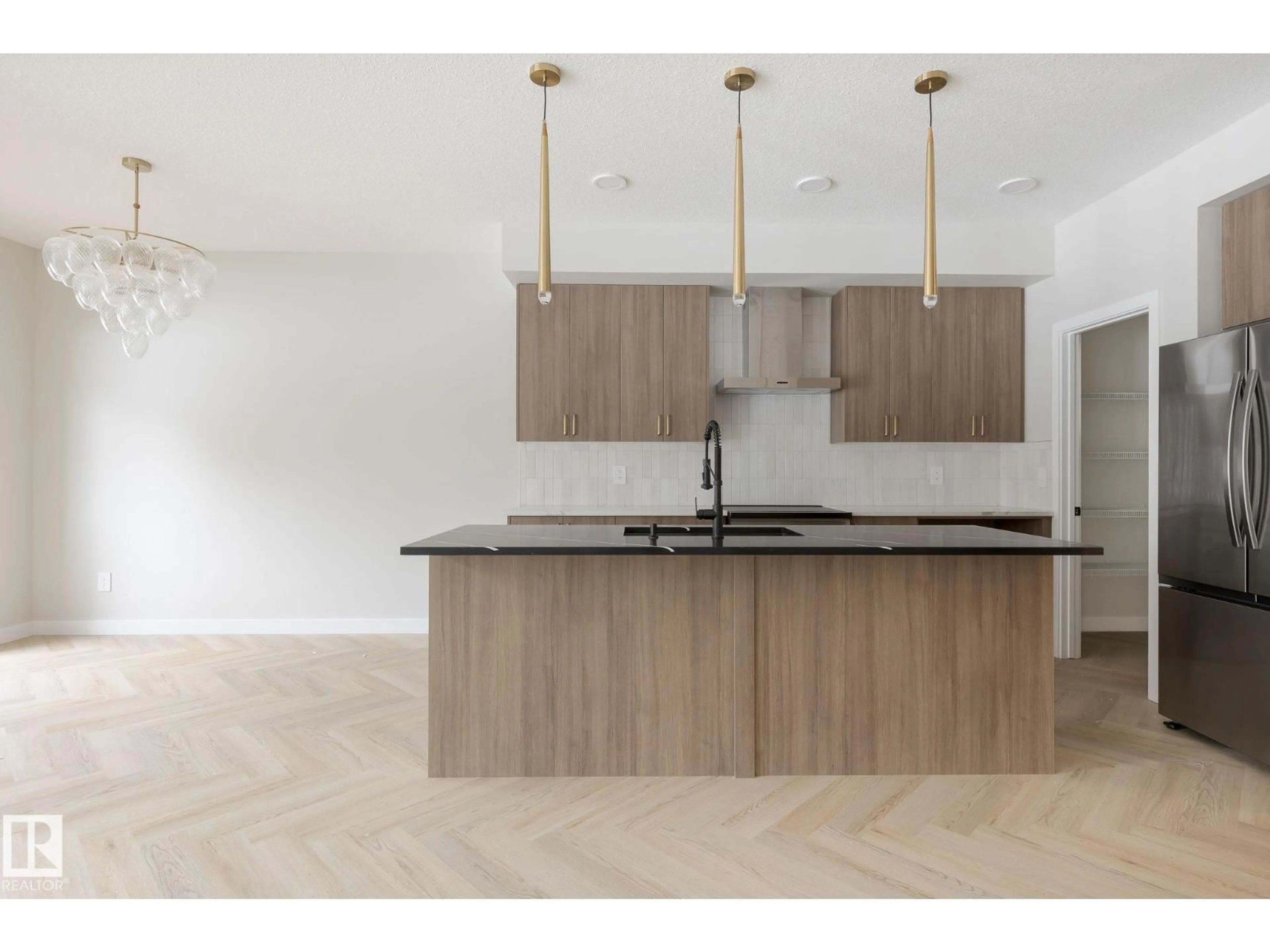 Open concept kitchen, wood/laminate floor for NW - 4003 207 ST, Edmonton Alberta T6M3G1
