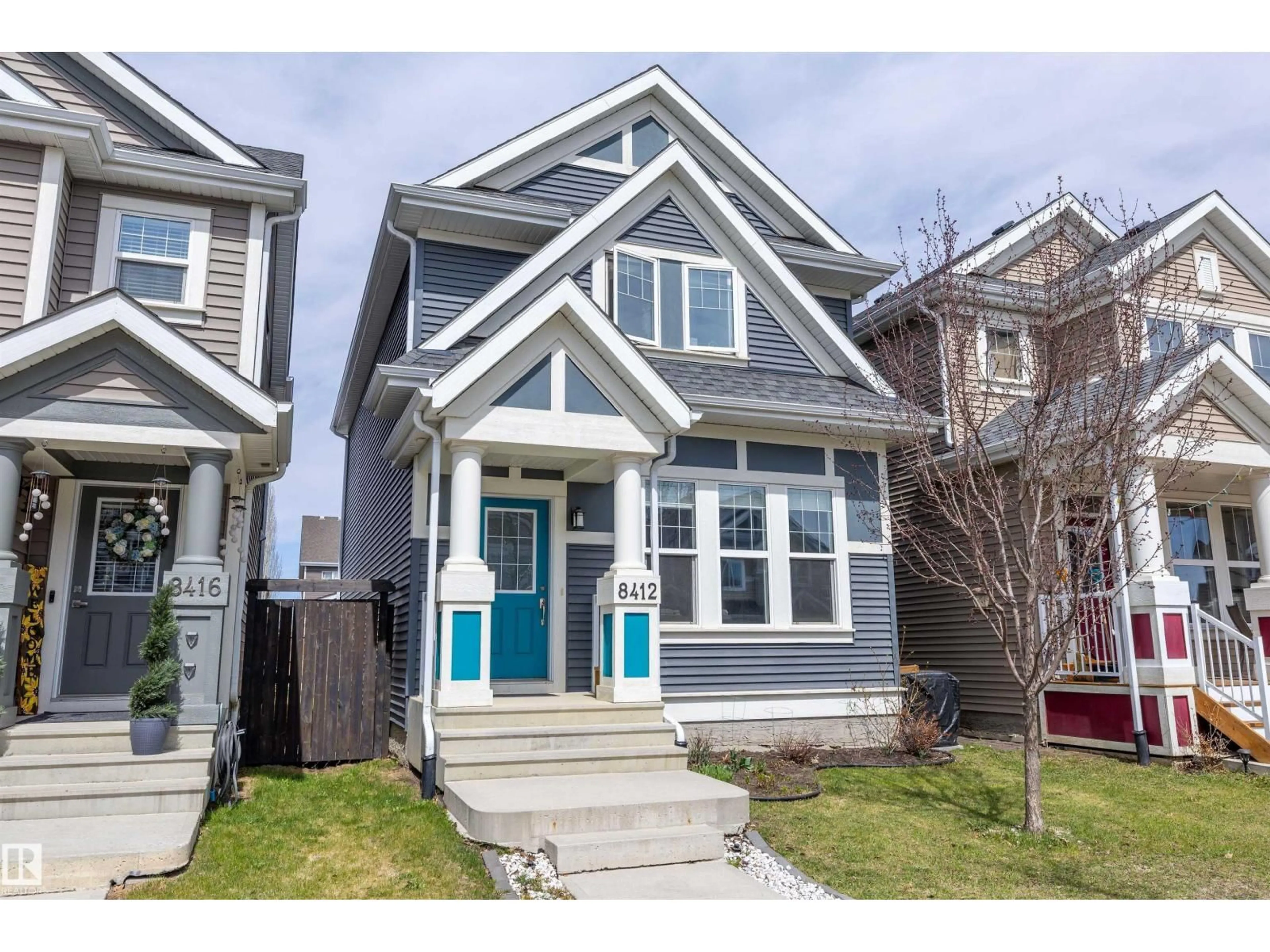 Home with vinyl exterior material, street for SW - 8412 24 AV, Edmonton Alberta T6X2G1