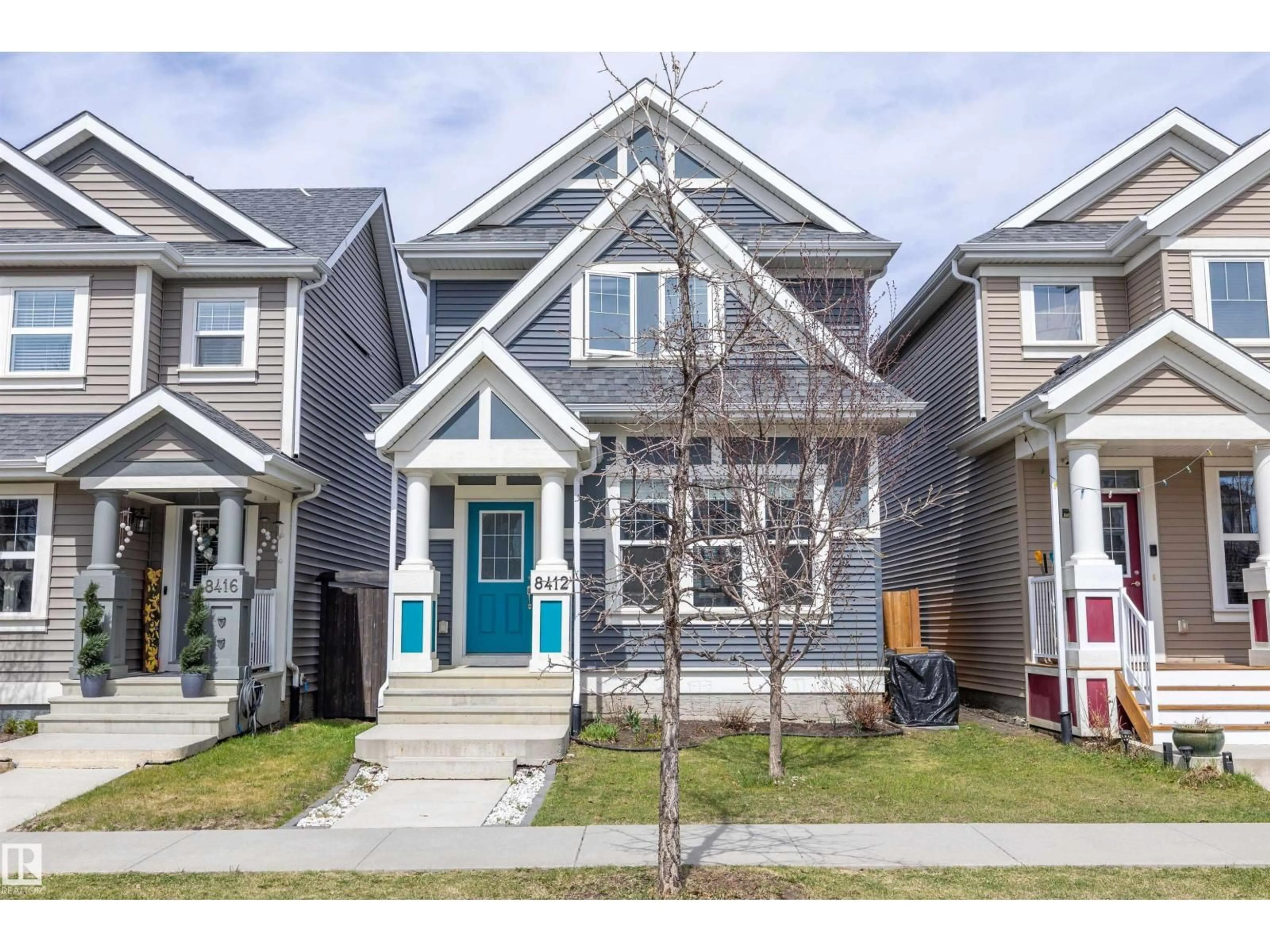 Home with vinyl exterior material, street for SW - 8412 24 AV, Edmonton Alberta T6X2G1