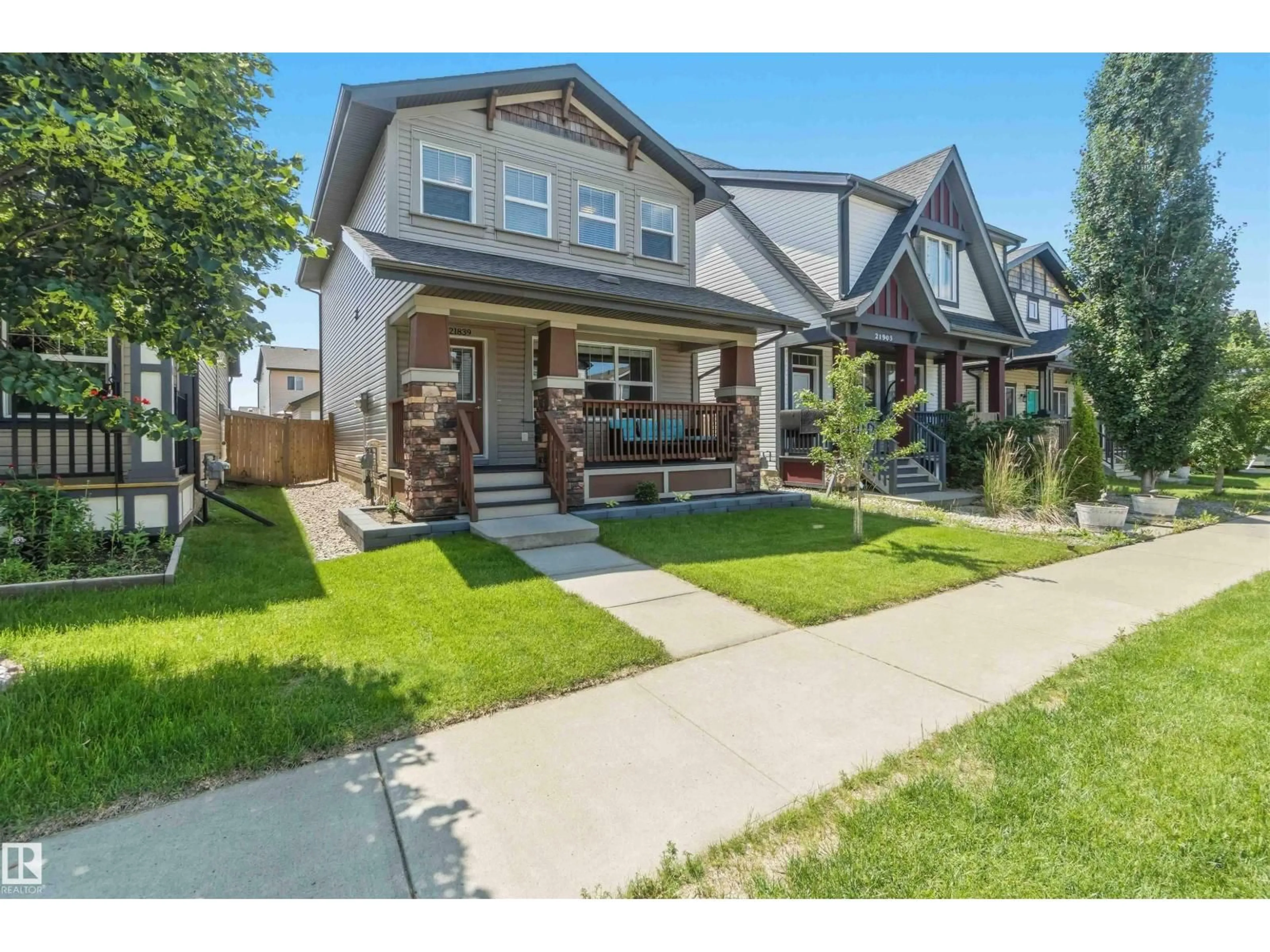 Home with vinyl exterior material, street for 21839 99 AV, Edmonton Alberta T5T4M5