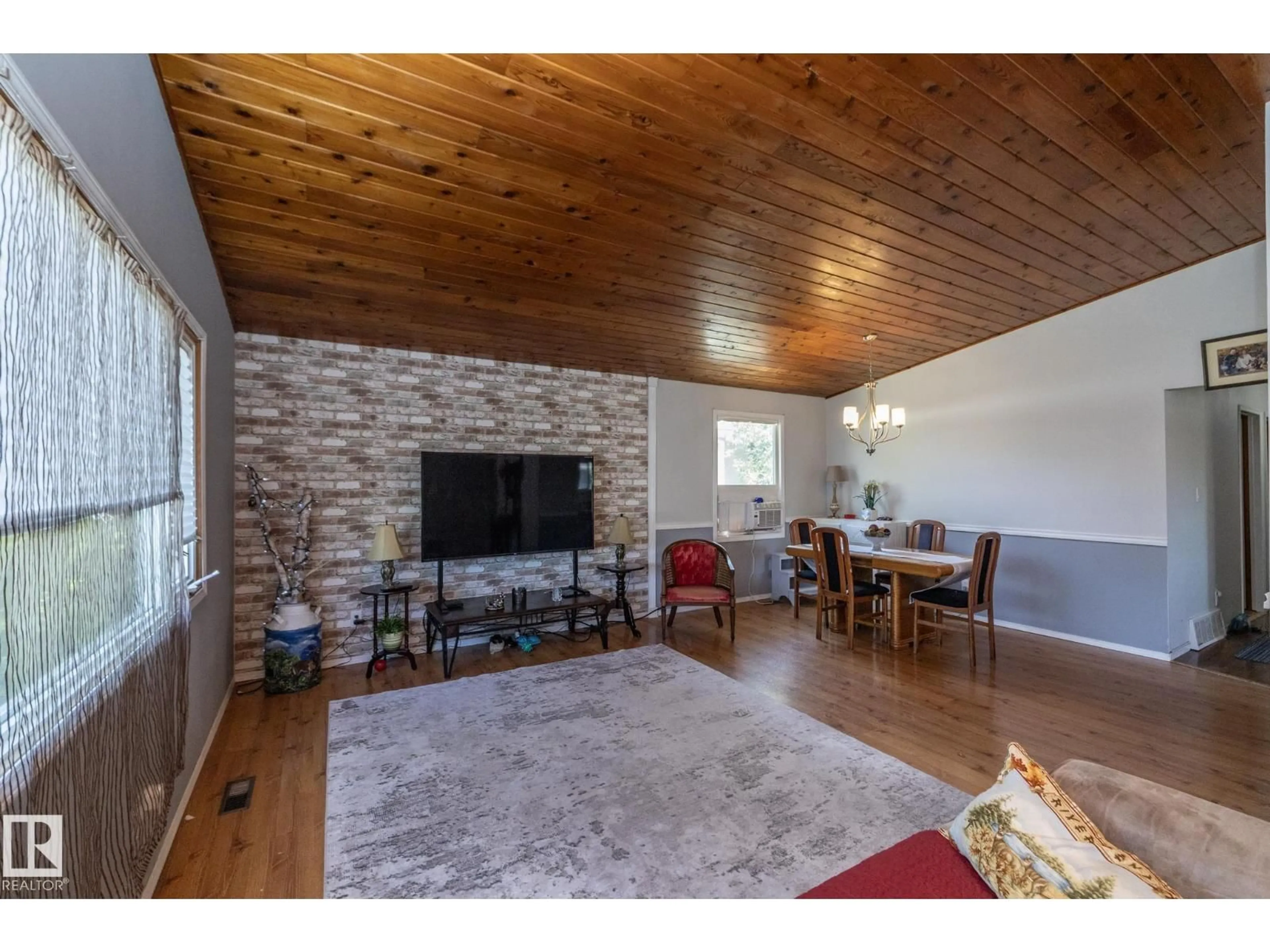 Living room with furniture, wood/laminate floor for 3608 44 ST, Leduc Alberta T9E6A1