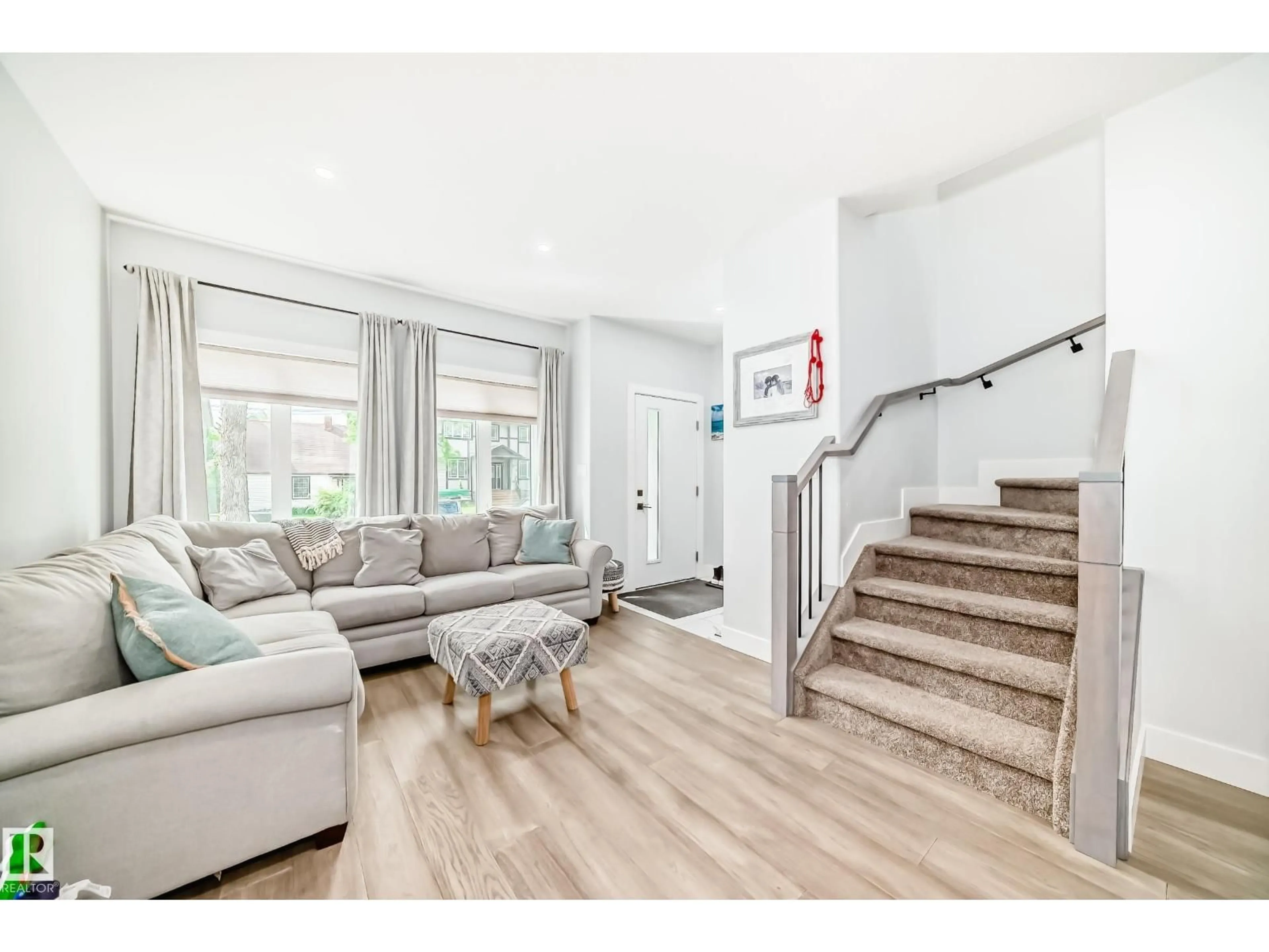 Living room with furniture, wood/laminate floor for NW - 9830 73 AV, Edmonton Alberta T6E1B6