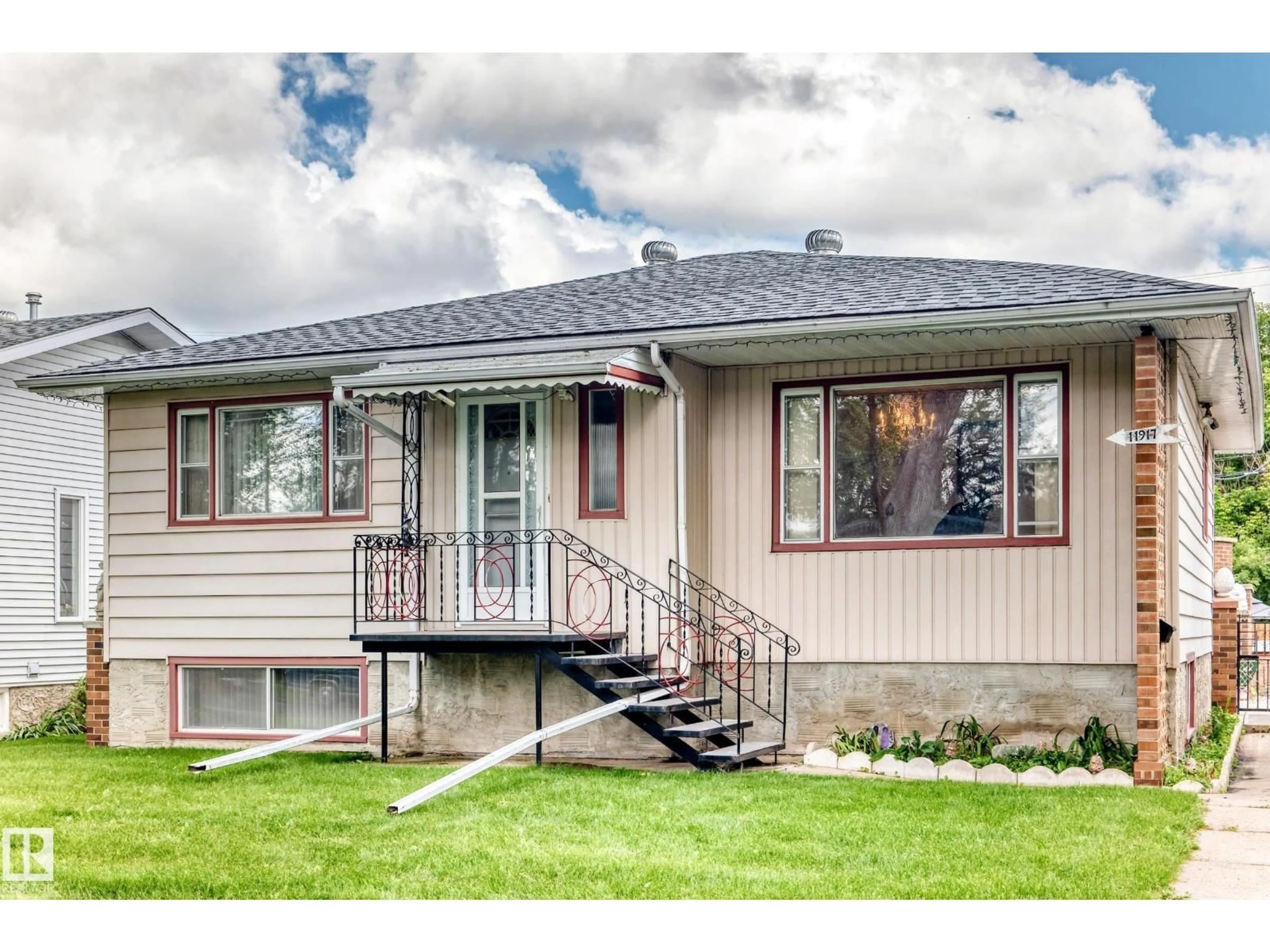 Home with vinyl exterior material, street for 11917 53 ST, Edmonton Alberta T5W3L4