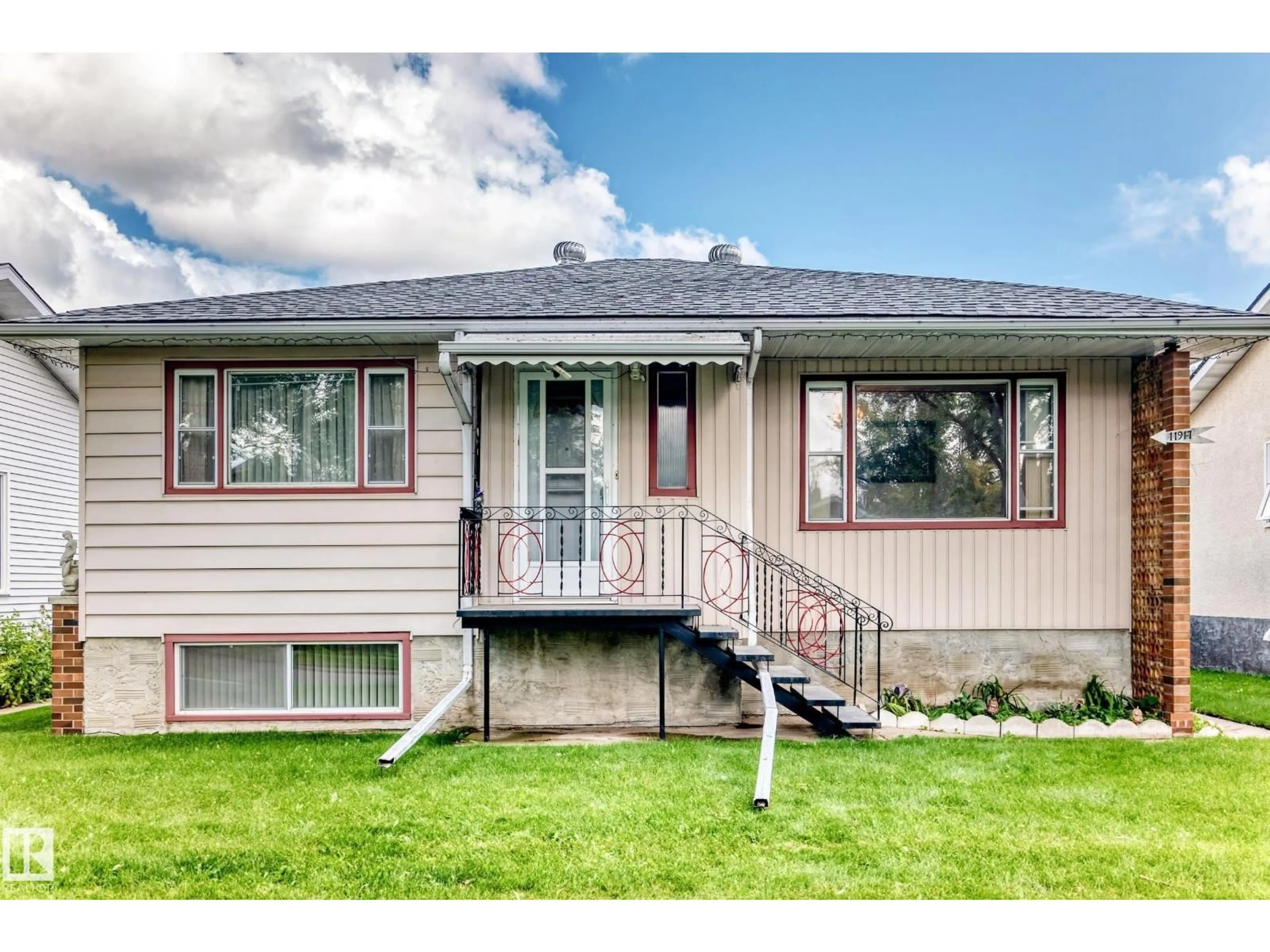 Home with vinyl exterior material, street for 11917 53 ST, Edmonton Alberta T5W3L4