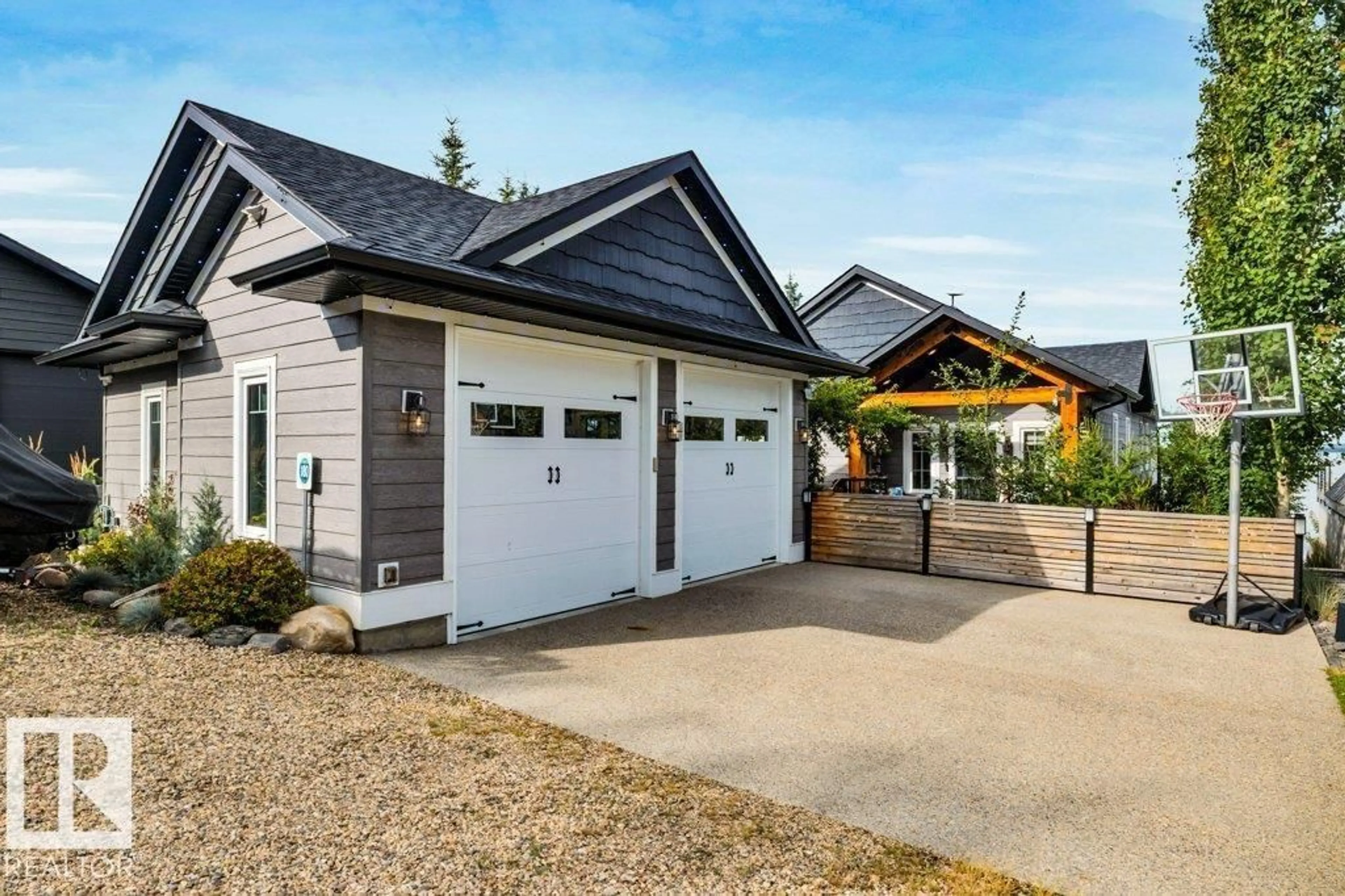 Home with vinyl exterior material, street for 180 CRYSTAL SPRINGS DRIVE, Rural Wetaskiwin County Alberta T0C2V0