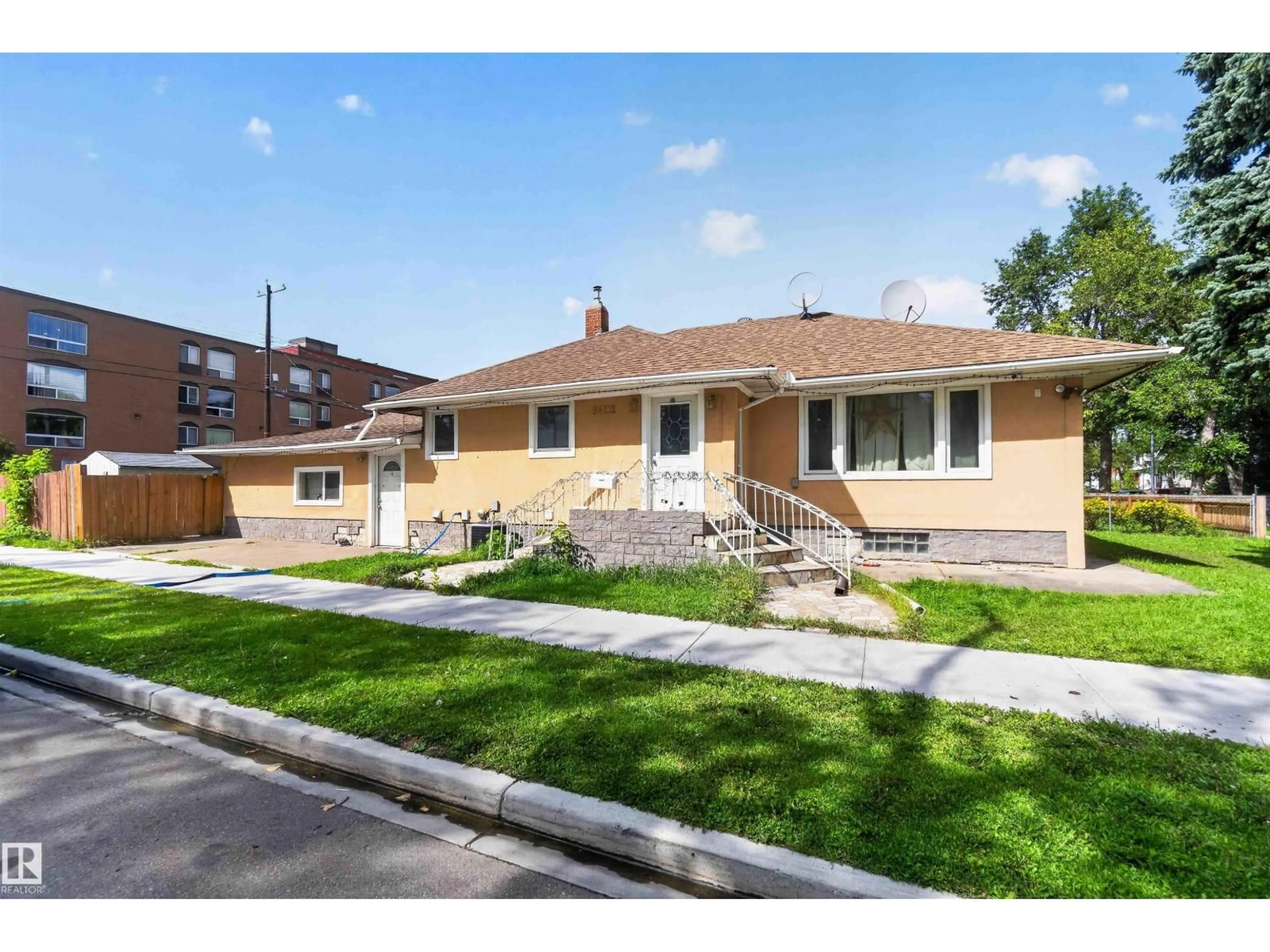 Home with brick exterior material, street for NW - 9402 117 AVENUE, Edmonton Alberta T5G0M4
