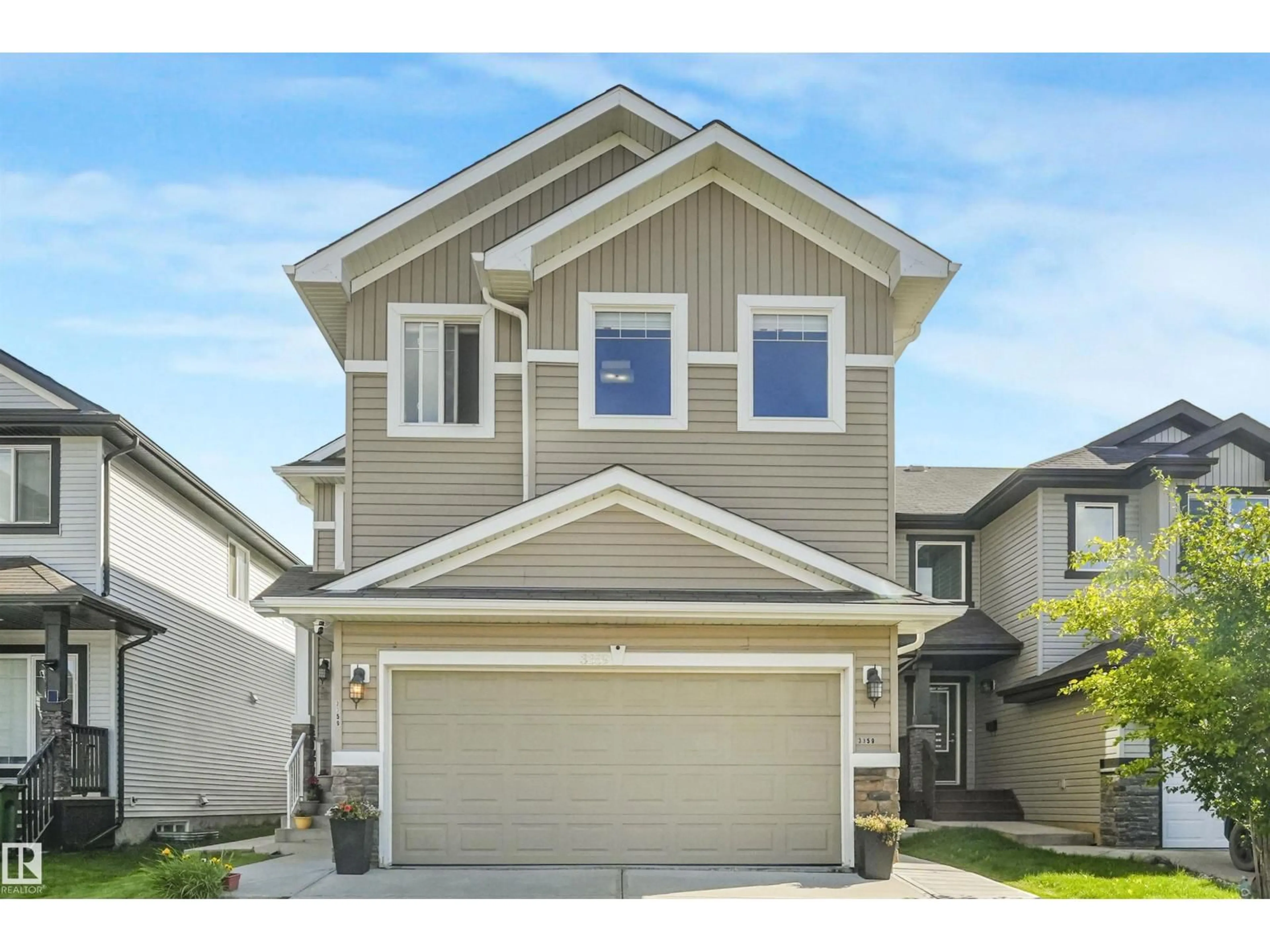 Home with vinyl exterior material, street for 3359 13 AV, Edmonton Alberta T6T0Z4