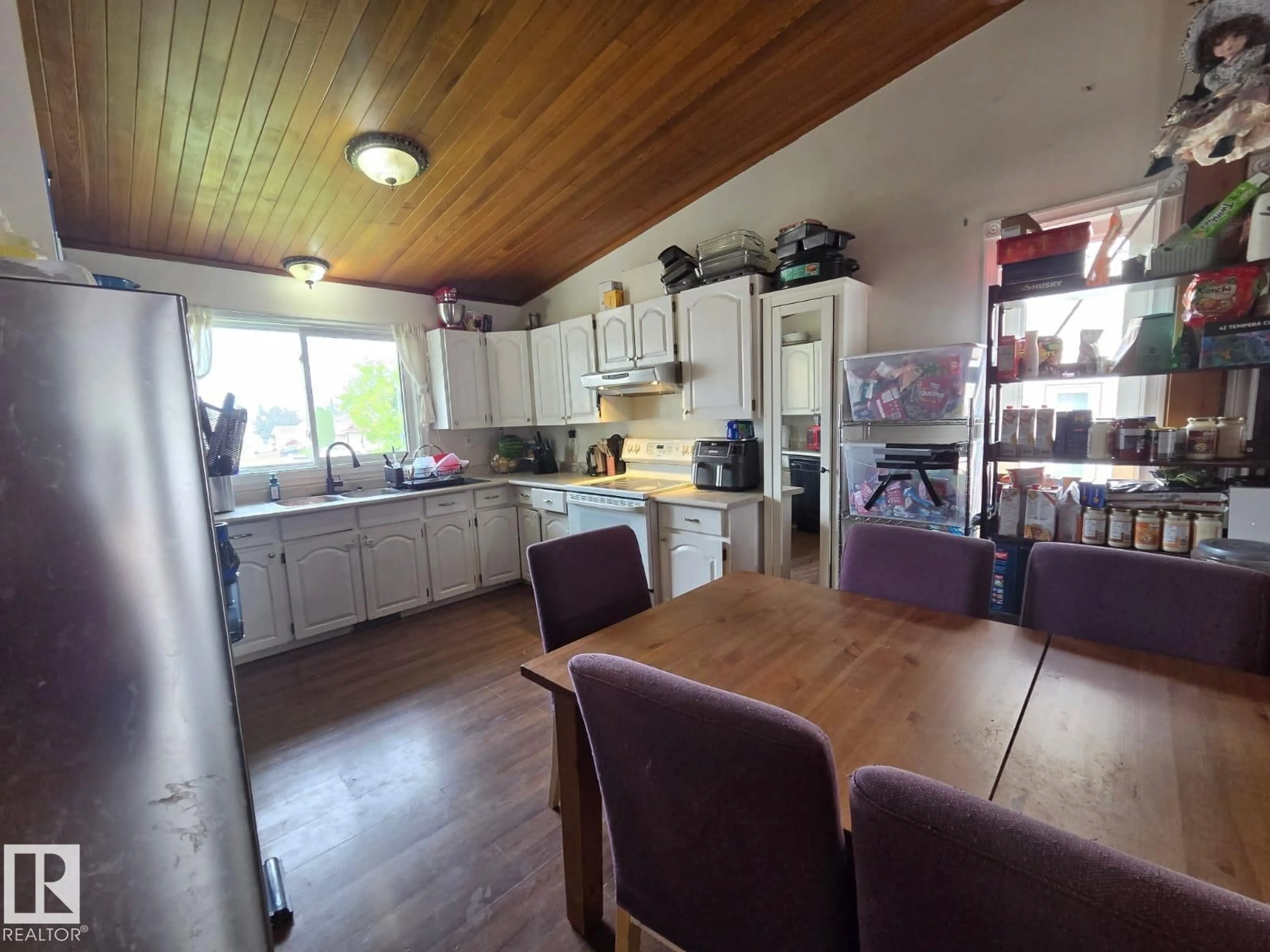Open concept kitchen, wood/laminate floor for 3511 28 AV, Edmonton Alberta T6L3Y5