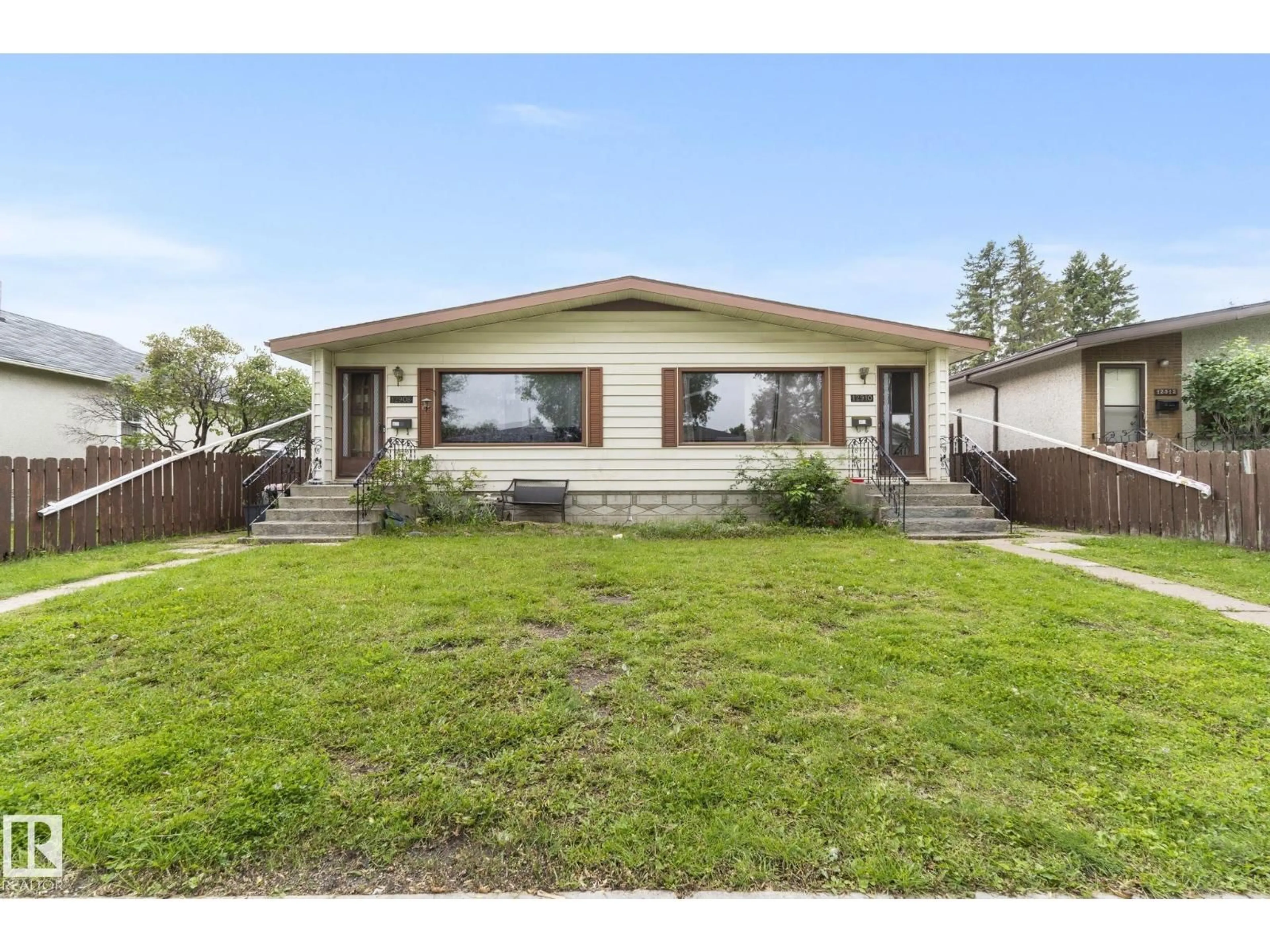 Home with vinyl exterior material, street for NW - 12908 & 12910 102 ST, Edmonton Alberta T5E4J3