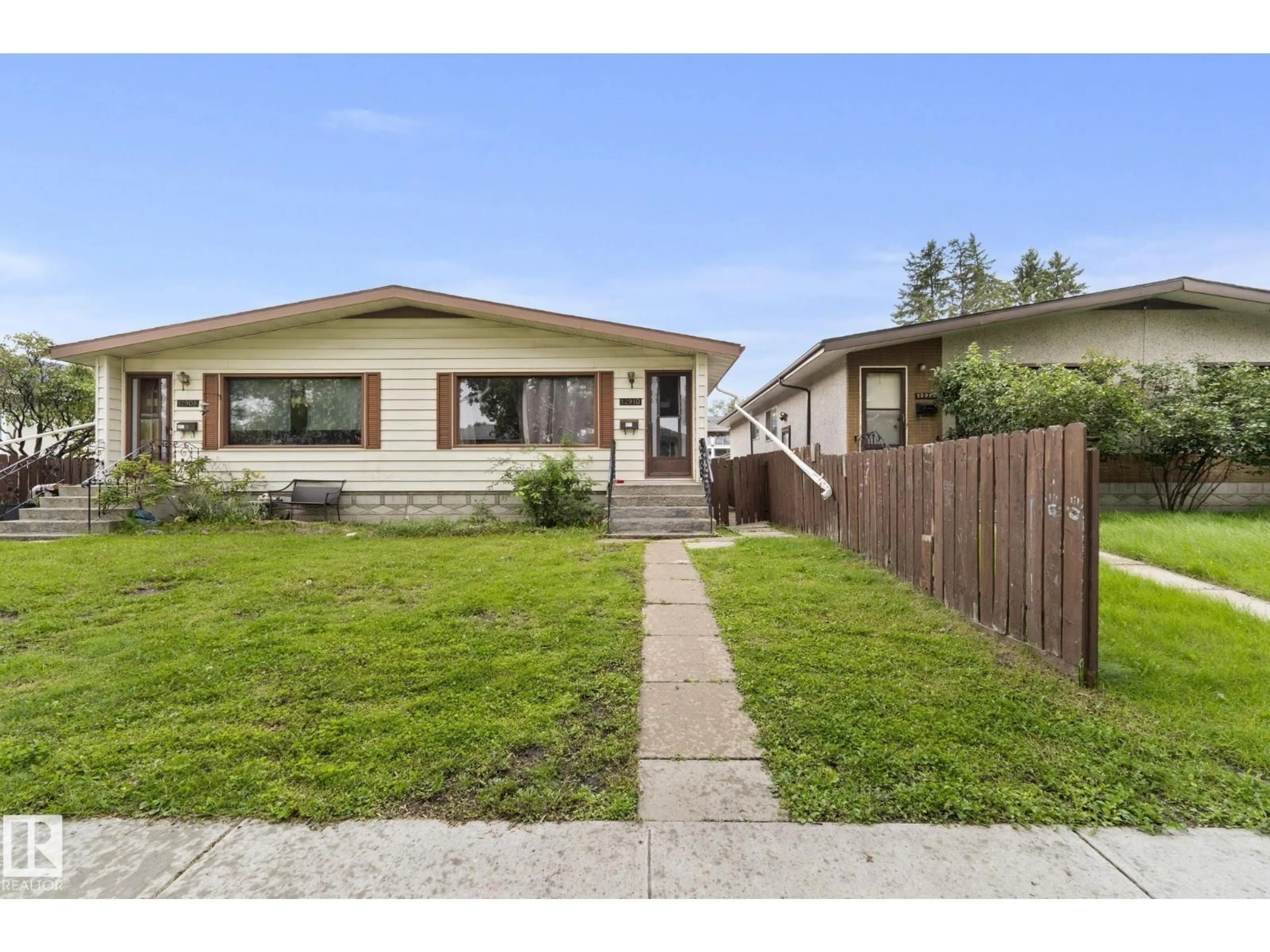 Home with vinyl exterior material, street for NW - 12908 & 12910 102 ST, Edmonton Alberta T5E4J3