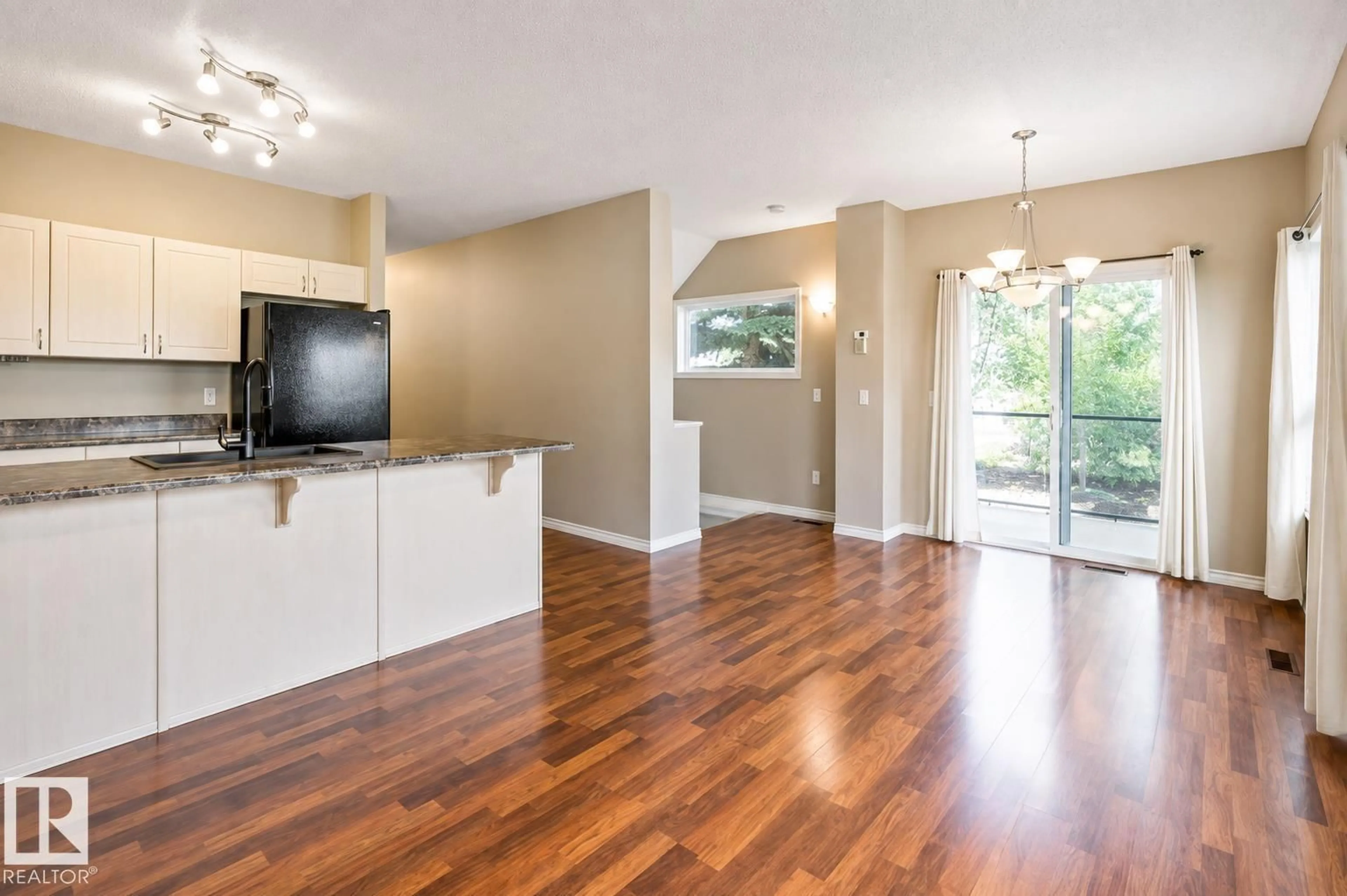 Open concept kitchen, wood/laminate floor for 59 - 3010 33 AV, Edmonton Alberta T6T0C3