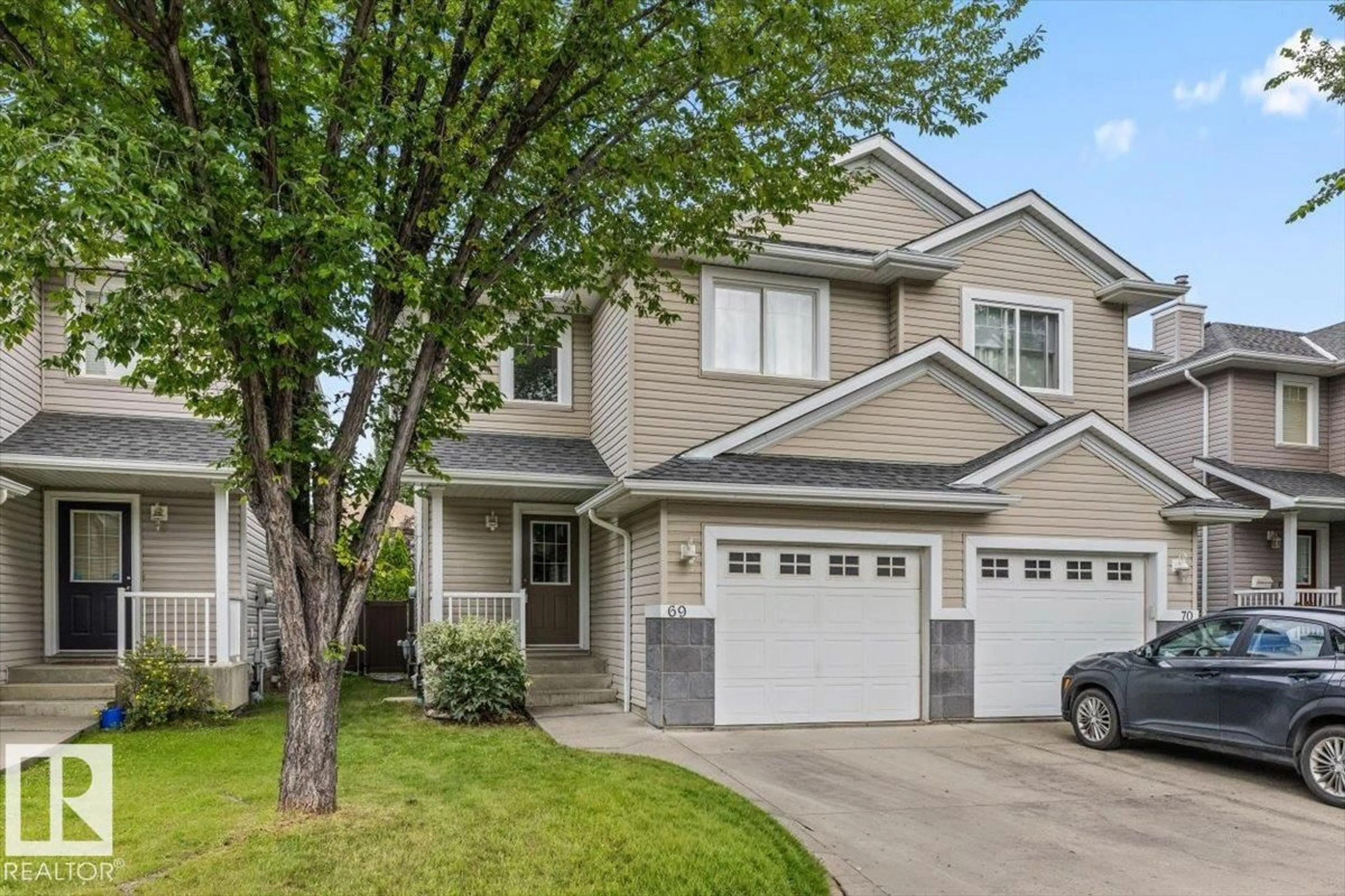 Home with vinyl exterior material, street for 69 - 1428 HODGSON WY, Edmonton Alberta T6R3P8