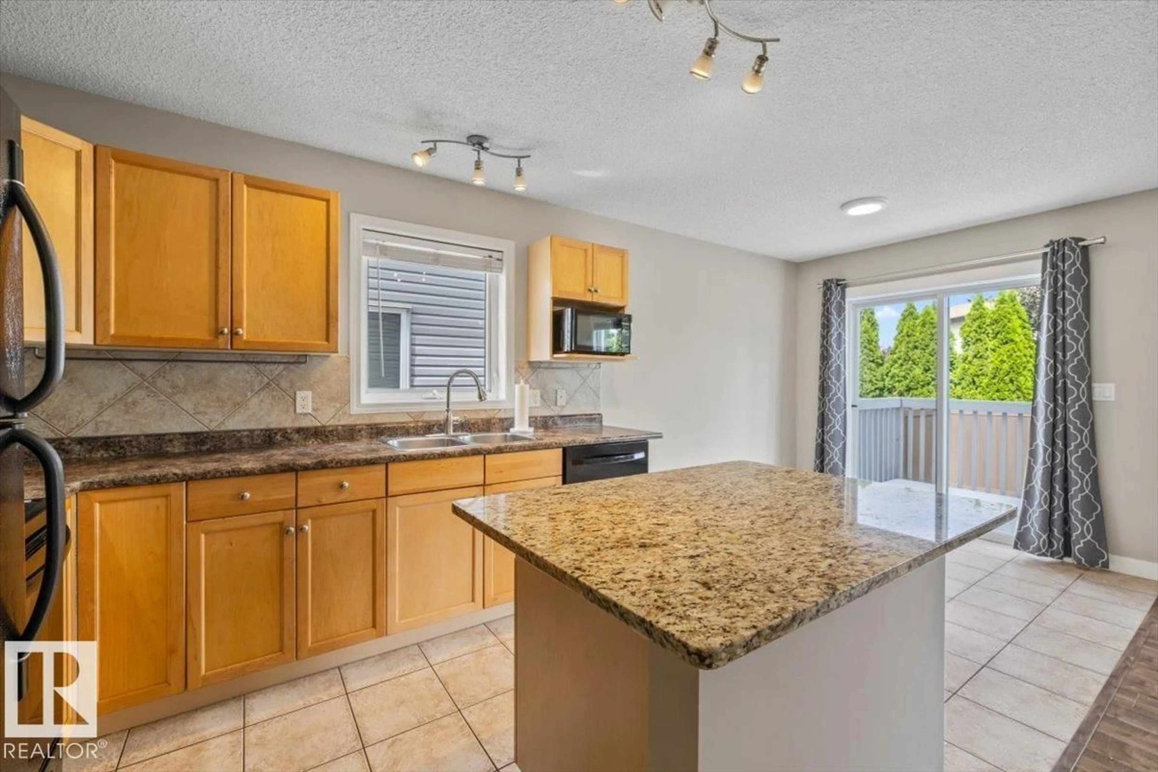 Open concept kitchen, ceramic/tile floor for 69 - 1428 HODGSON WY, Edmonton Alberta T6R3P8