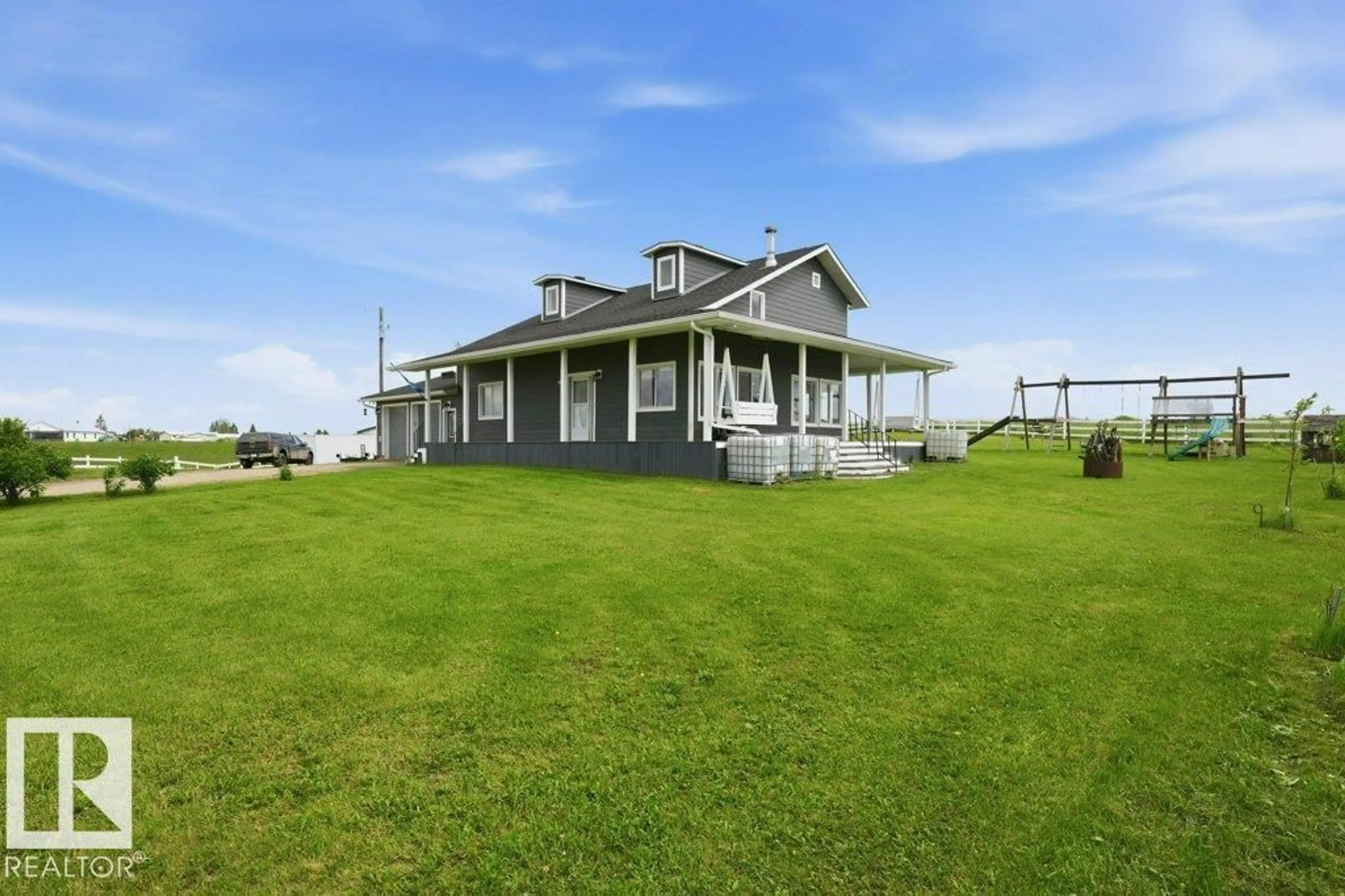 A pic from outside/outdoor area/front of a property/back of a property/a pic from drone, building for 58111 LILY LAKE RD, Rural Sturgeon County Alberta T0G1L0