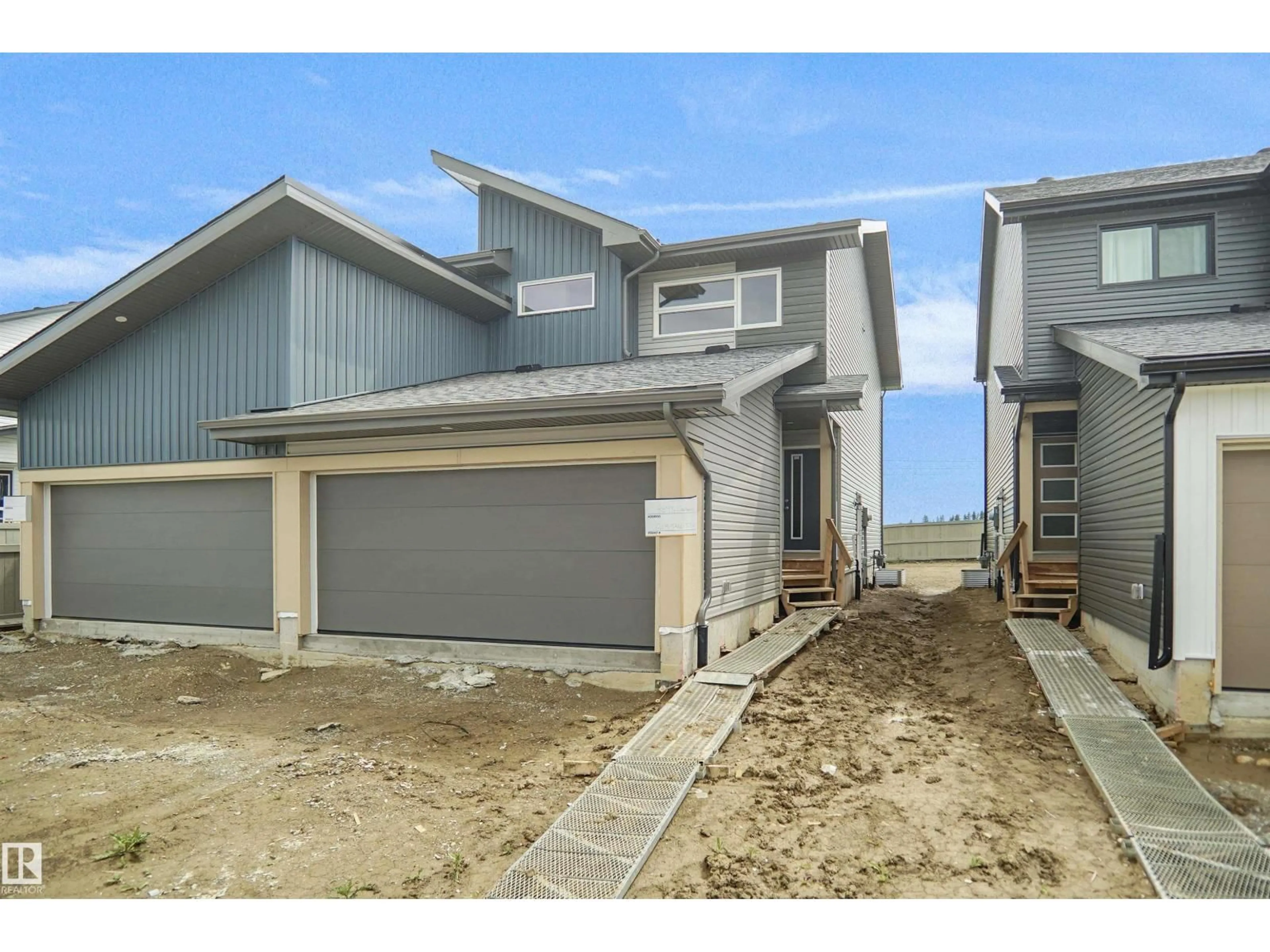 A pic from outside/outdoor area/front of a property/back of a property/a pic from drone, street for 31 EMMETT WY, Spruce Grove Alberta T7X3C7