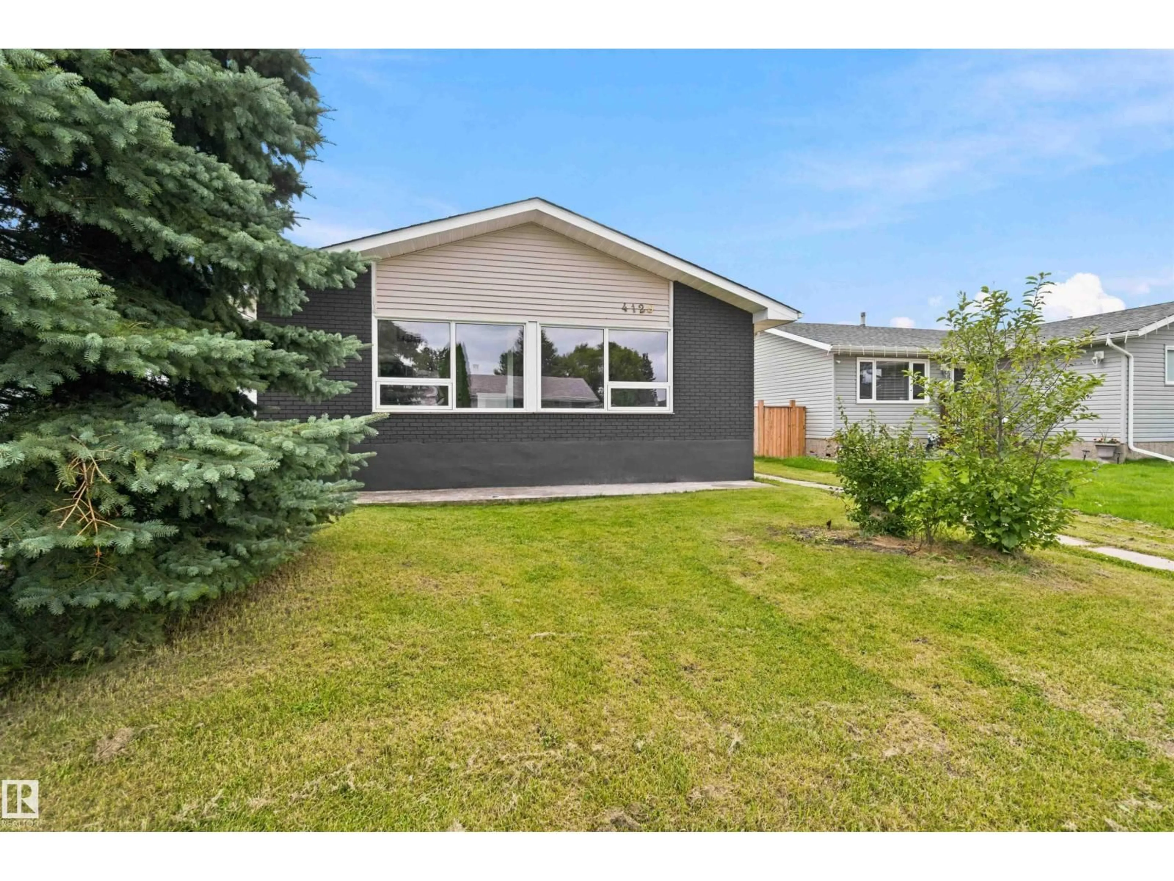 Home with vinyl exterior material, street for 4129 134A AV, Edmonton Alberta T5A2N2