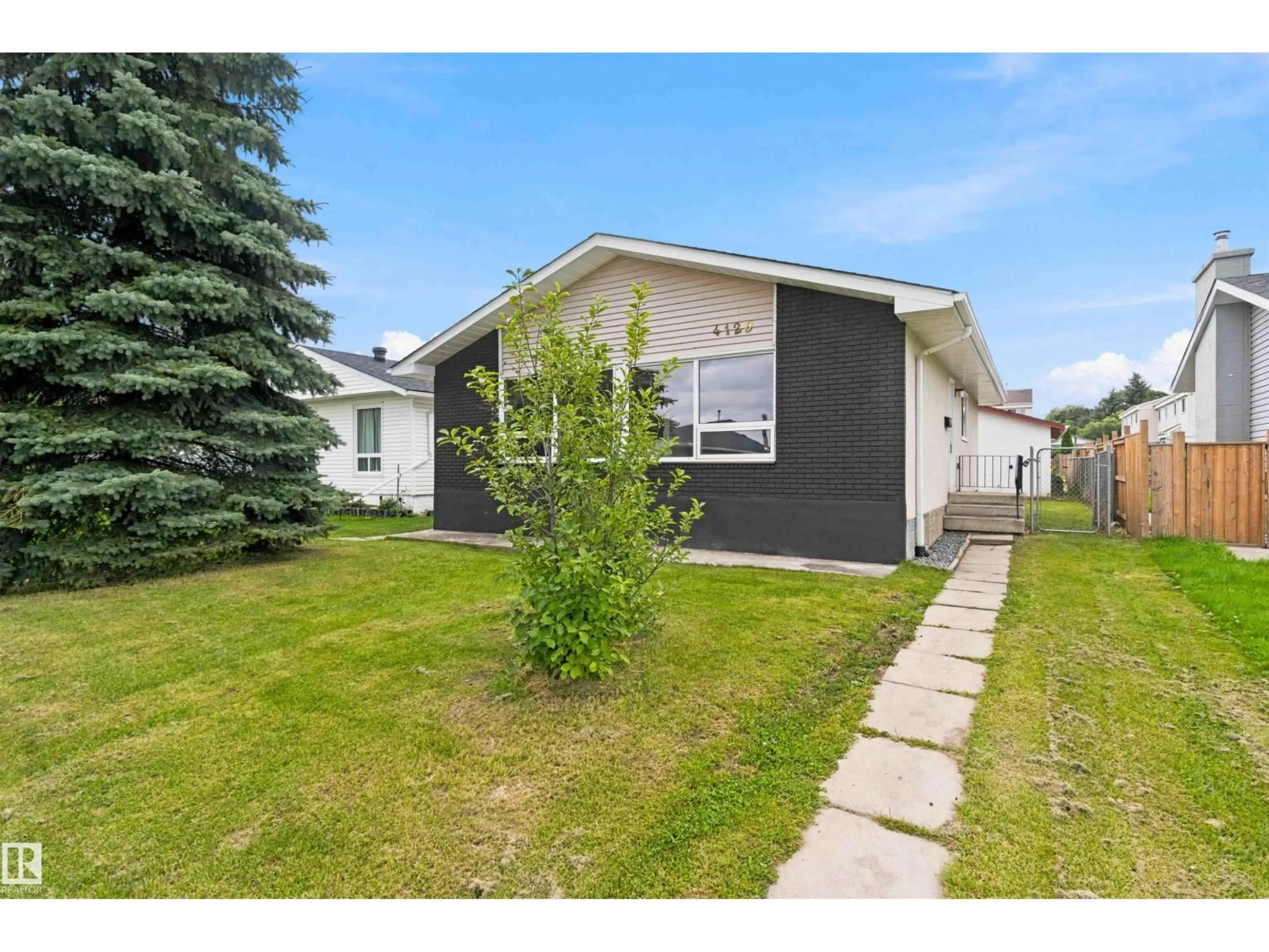 Home with vinyl exterior material, street for 4129 134A AV, Edmonton Alberta T5A2N2