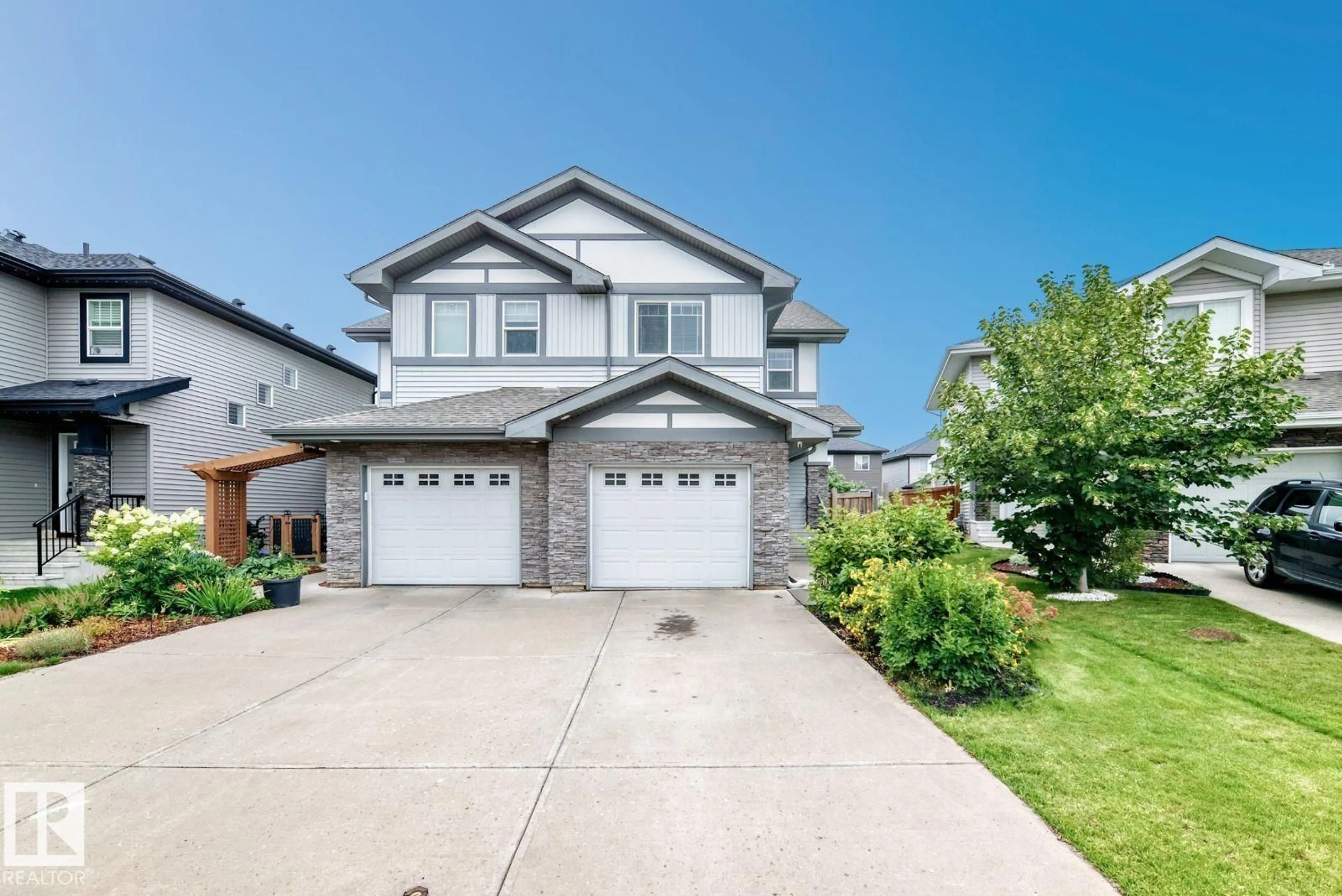 Home with vinyl exterior material, street for SW - 1112 176 ST, Edmonton Alberta T6W2B7