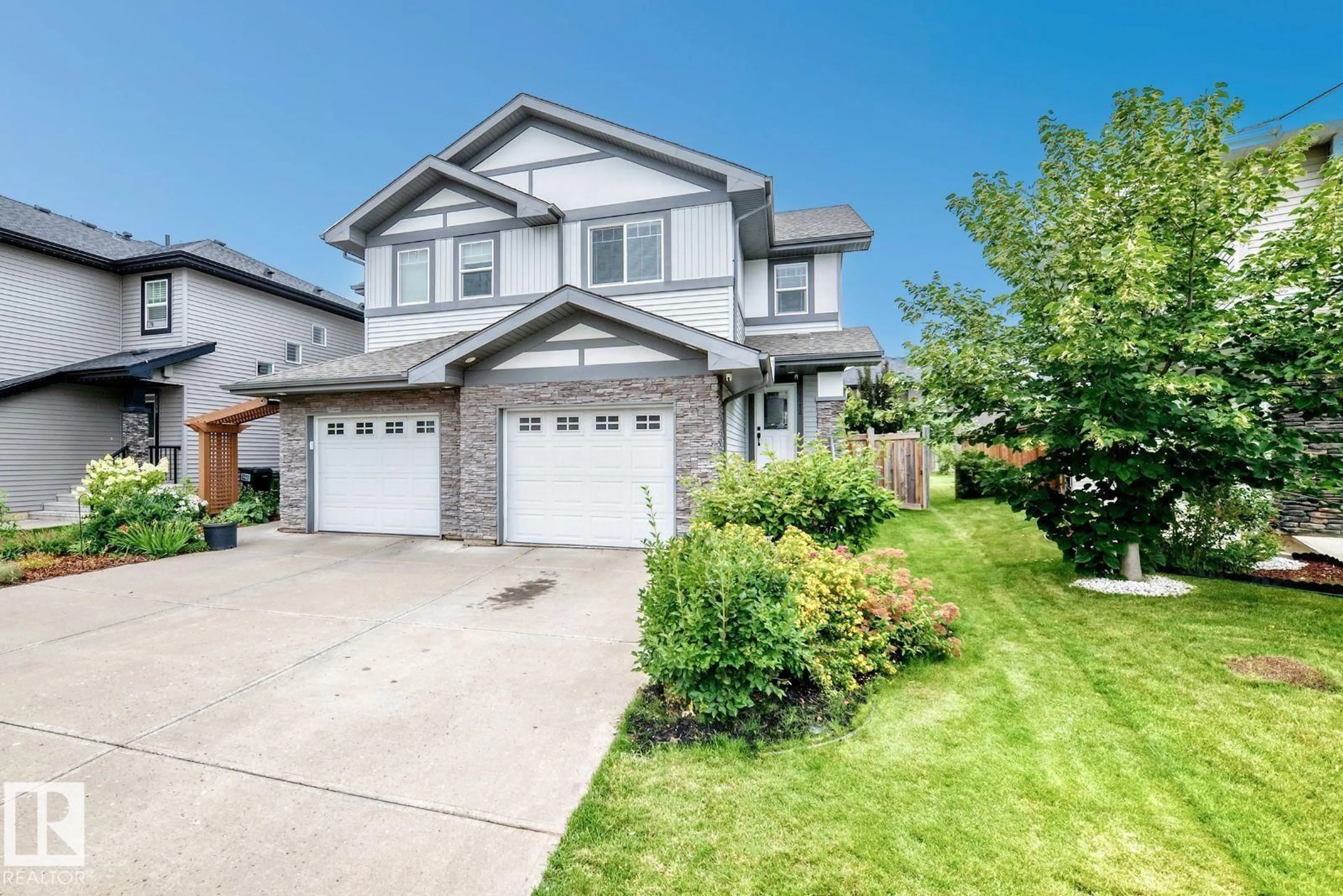 Home with vinyl exterior material, street for SW - 1112 176 ST, Edmonton Alberta T6W2B7