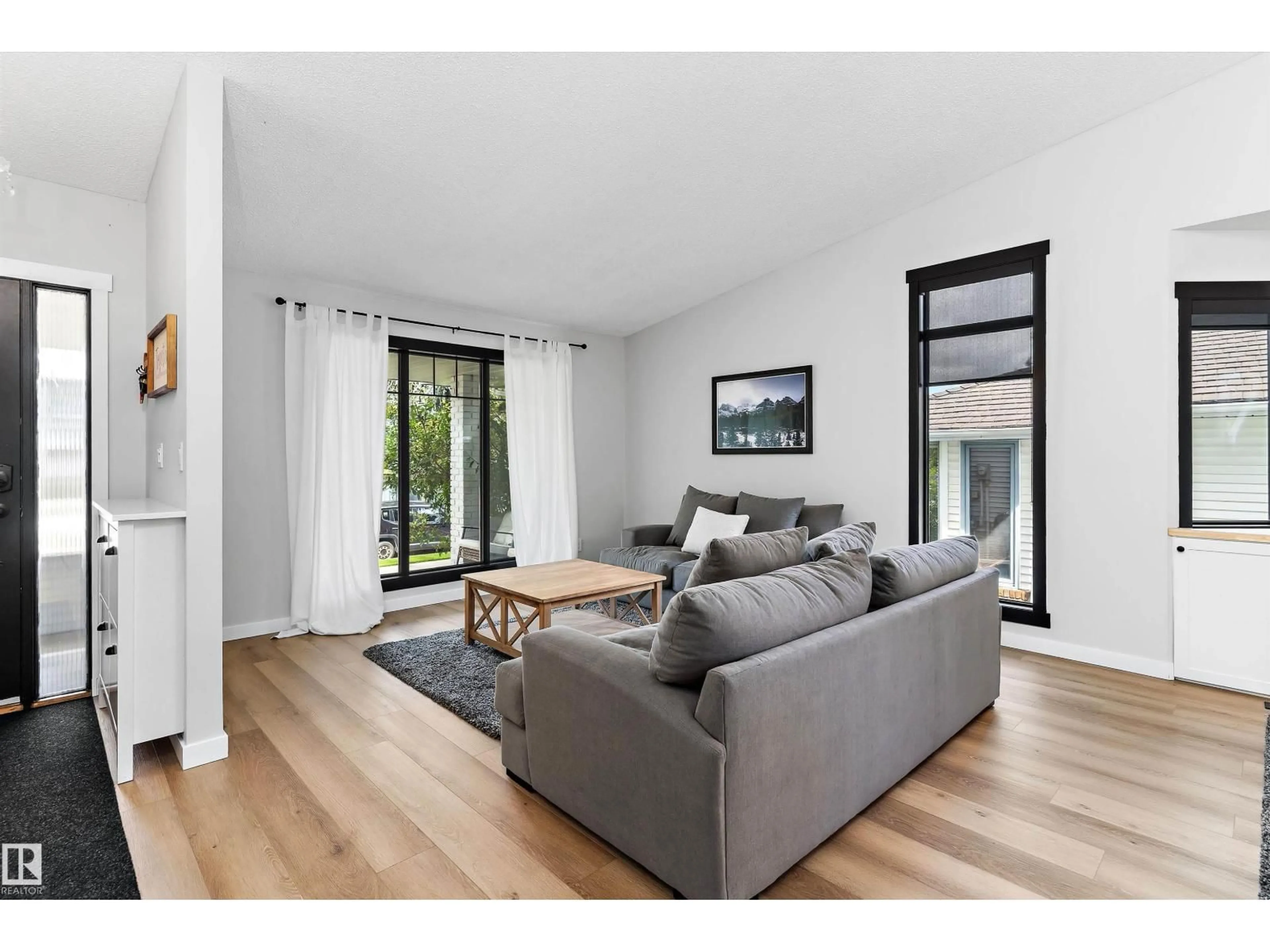 Living room with furniture, wood/laminate floor for 4 NOTTINGHAM CR, Sherwood Park Alberta T8A5H6