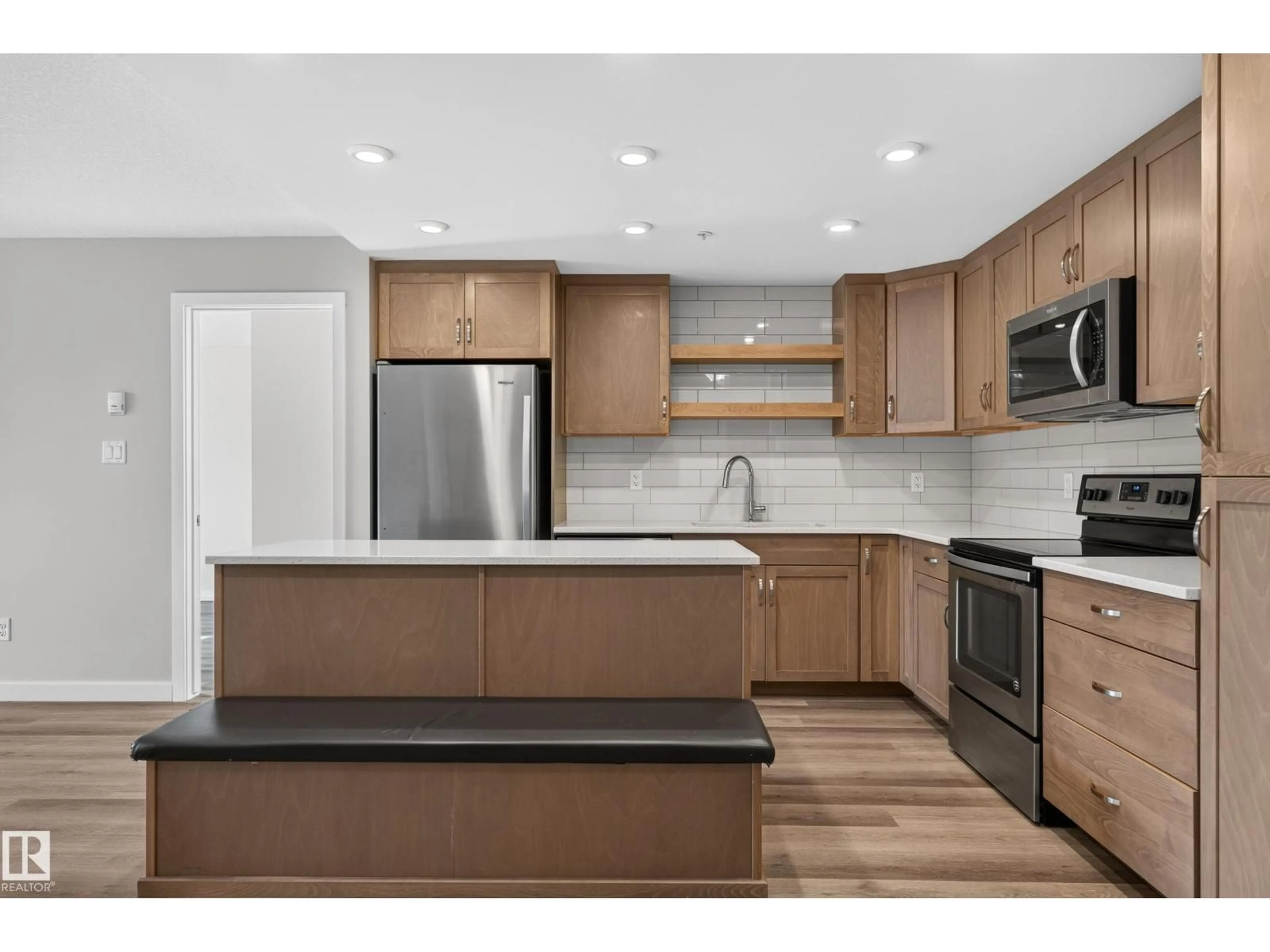 Open concept kitchen, wood/laminate floor for #131 - 5504 SCHONSEE DR, Edmonton Alberta T5Z0N9