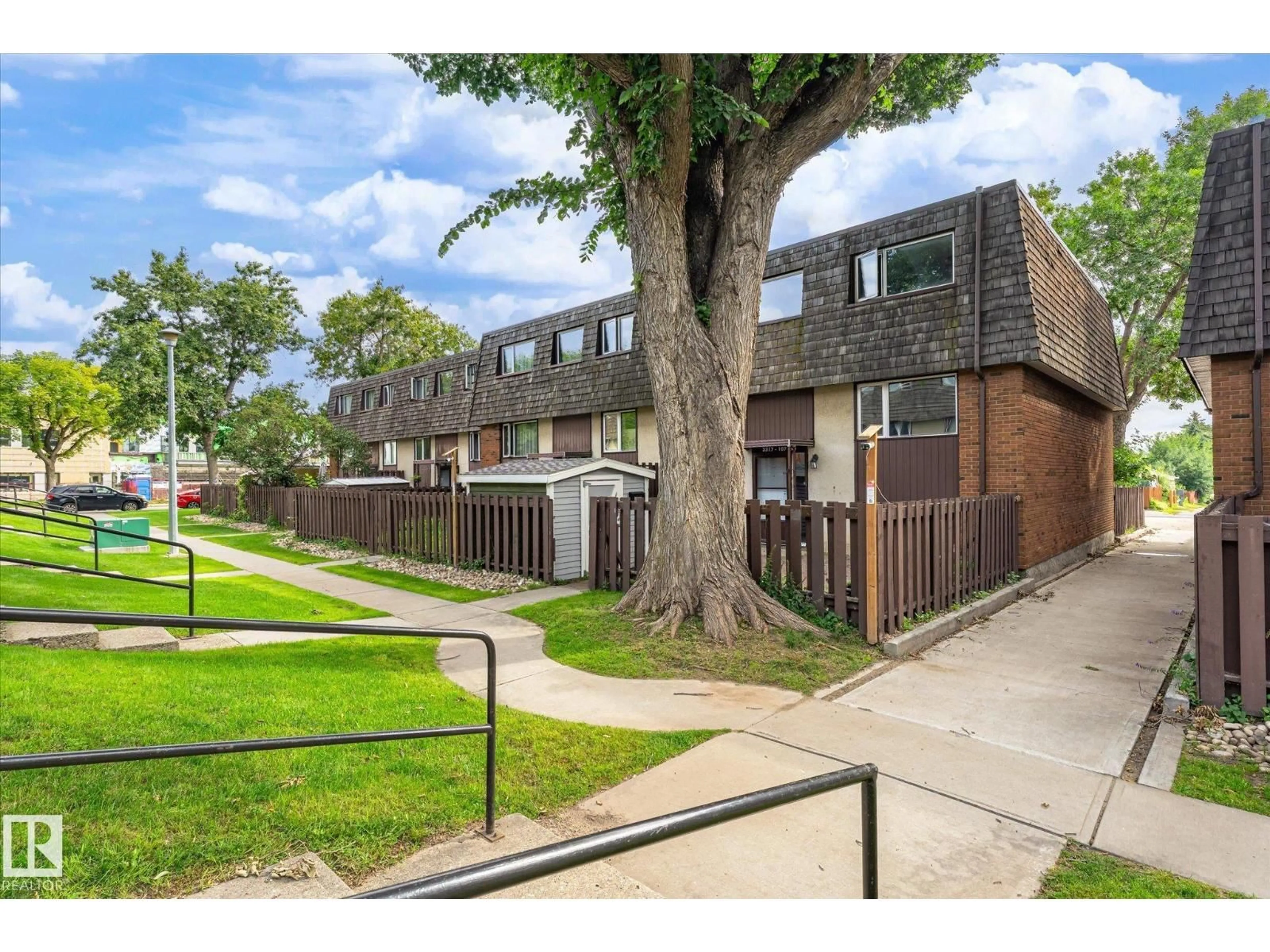 A pic from outside/outdoor area/front of a property/back of a property/a pic from drone, street for 3317 107 AV, Edmonton Alberta T5W0C6