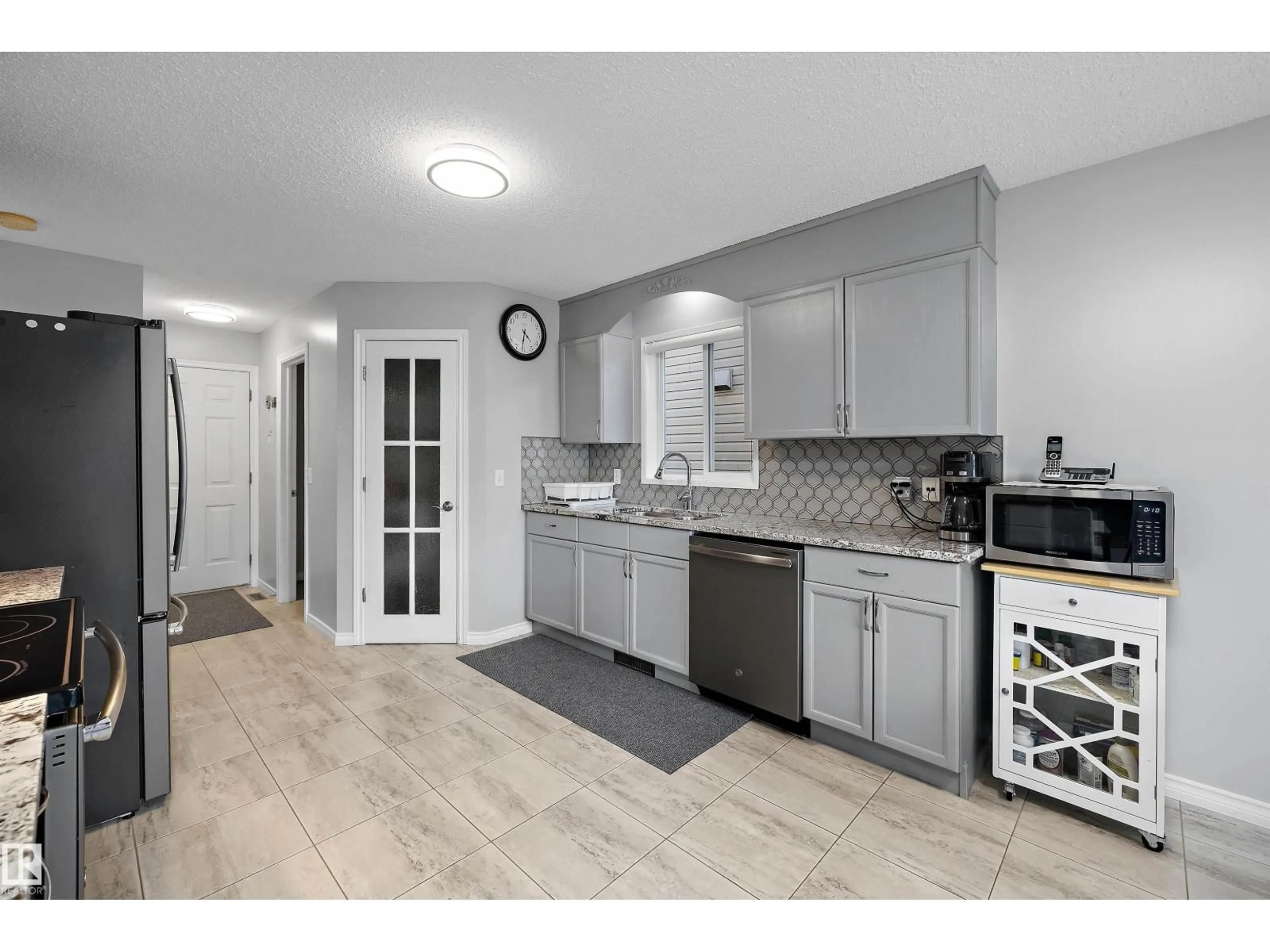 Open concept kitchen, ceramic/tile floor for NW - 11528 168 AV, Edmonton Alberta T5X6B6