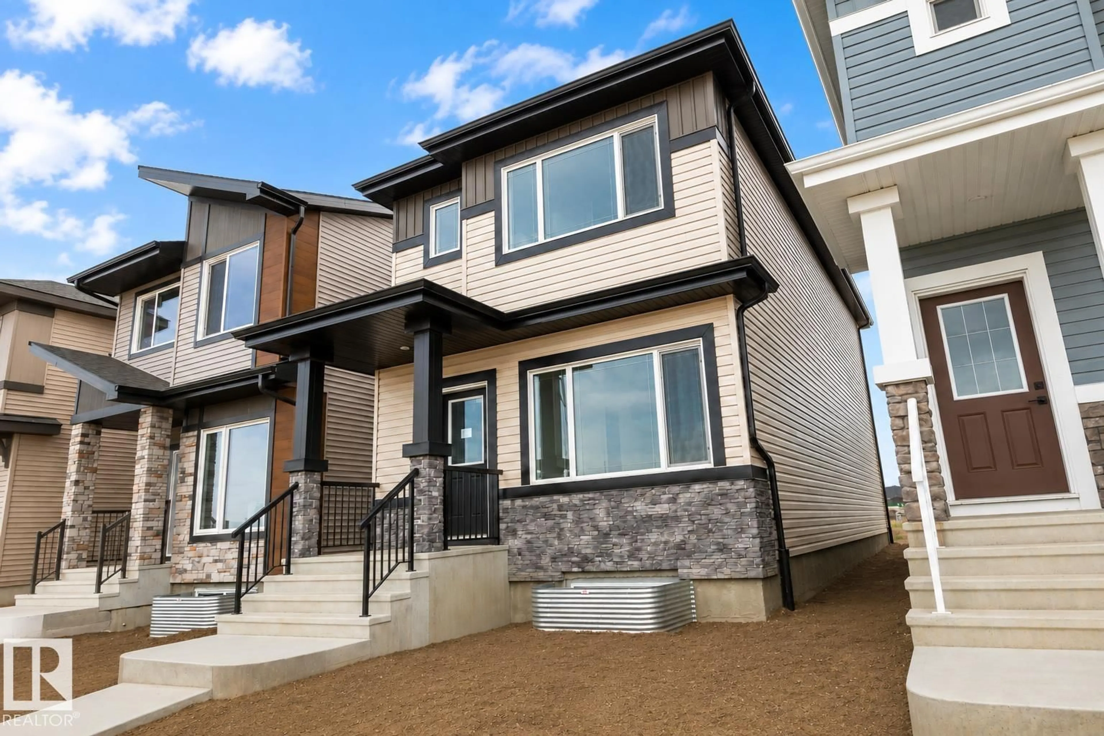 Home with vinyl exterior material, street for NE - 219 157 AV, Edmonton Alberta T5Y4M1