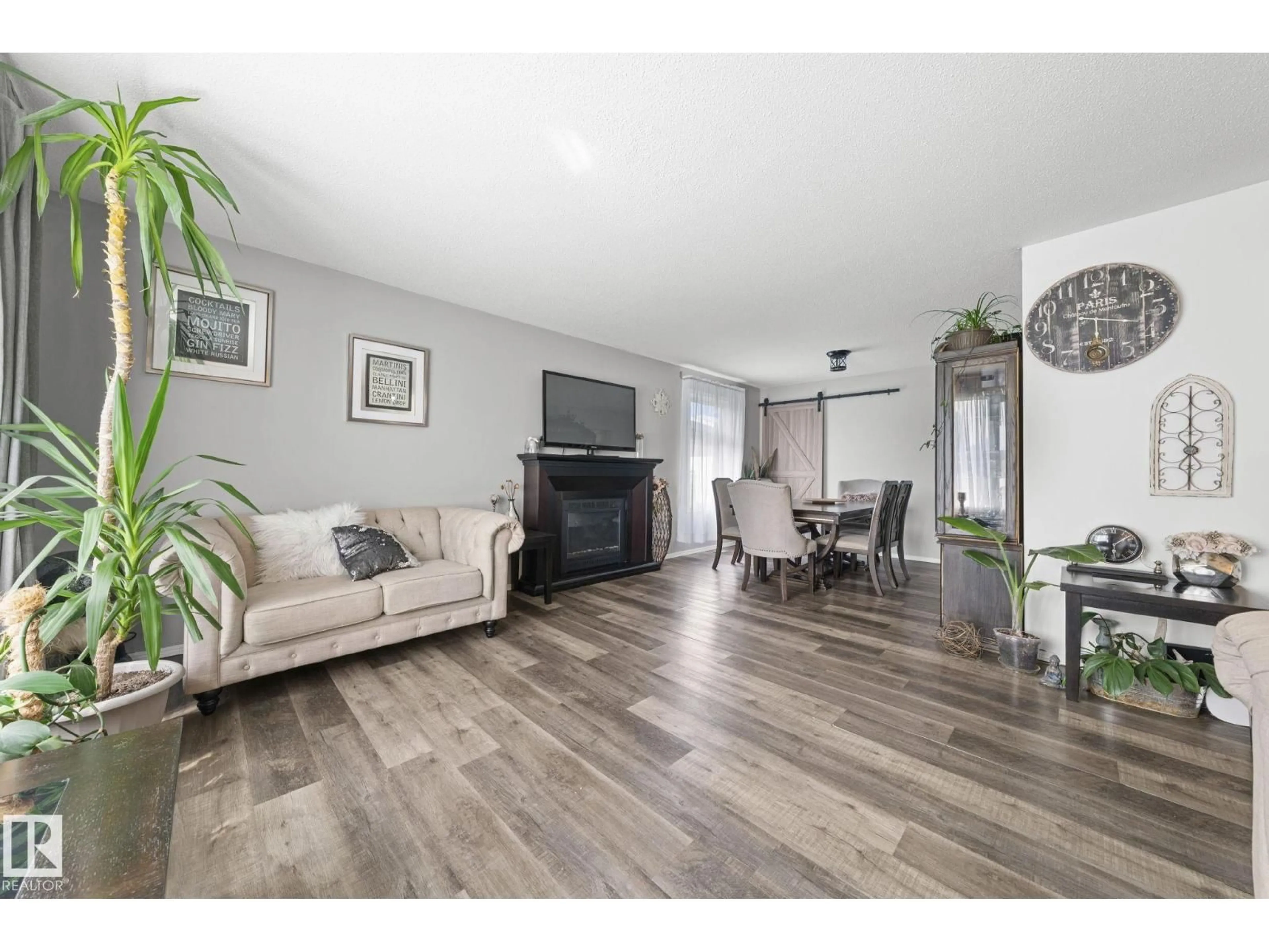 Living room with furniture, wood/laminate floor for 11119 31ST NW, Edmonton Alberta T5W1W9