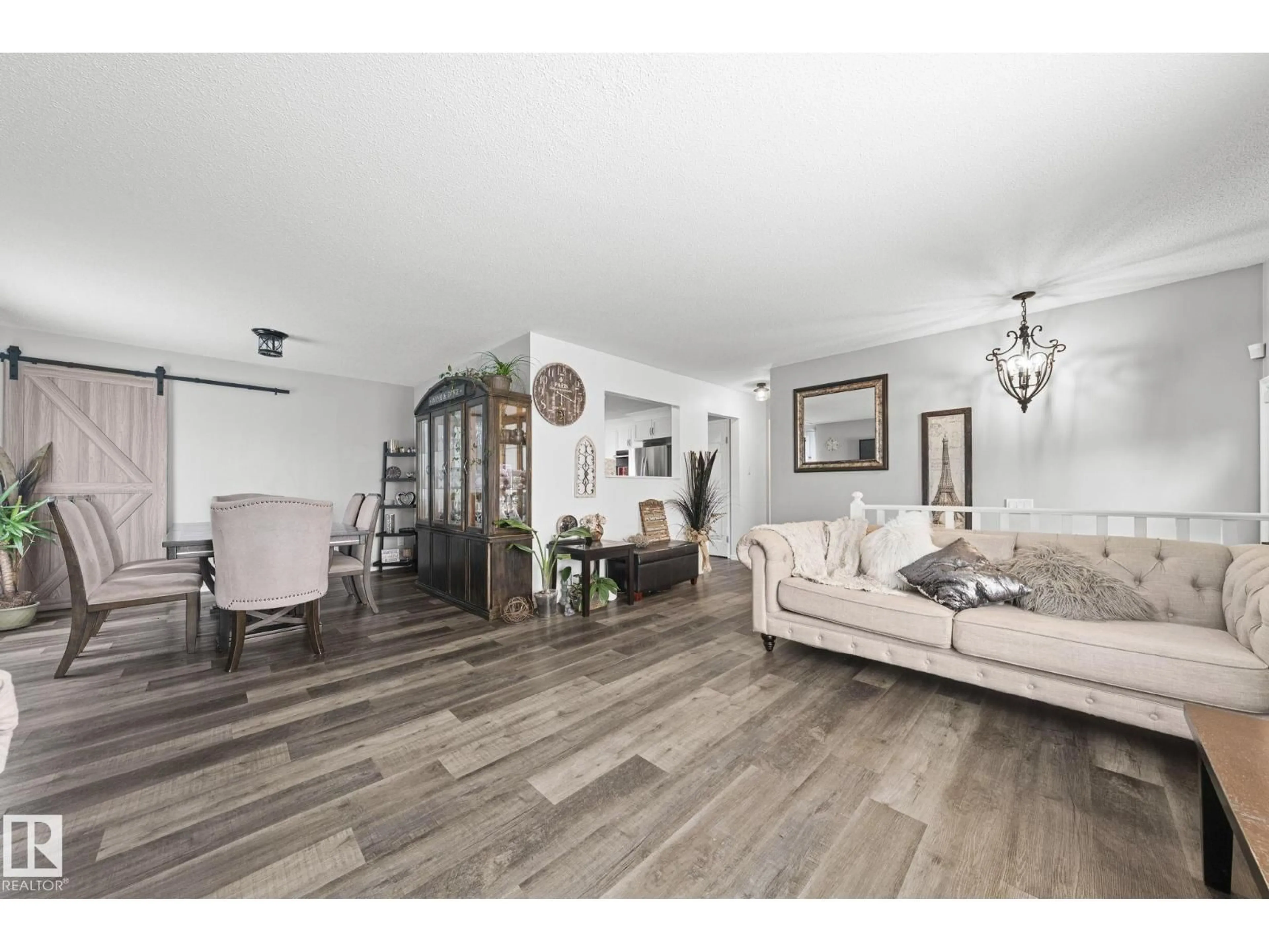 Living room with furniture, wood/laminate floor for 11119 31ST NW, Edmonton Alberta T5W1W9