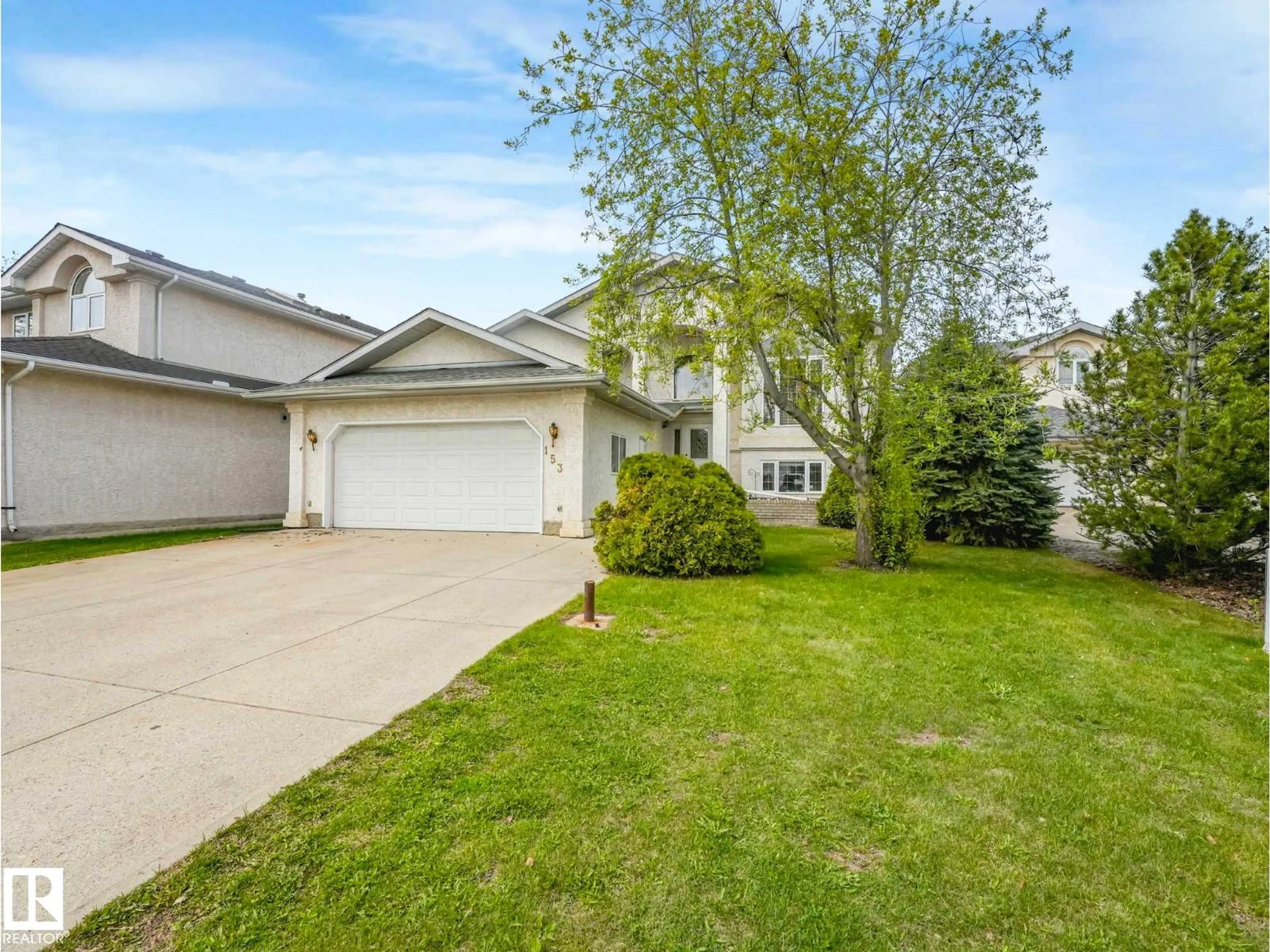 Home with vinyl exterior material, street for 153 KULAWY DR, Edmonton Alberta T6L6Y9