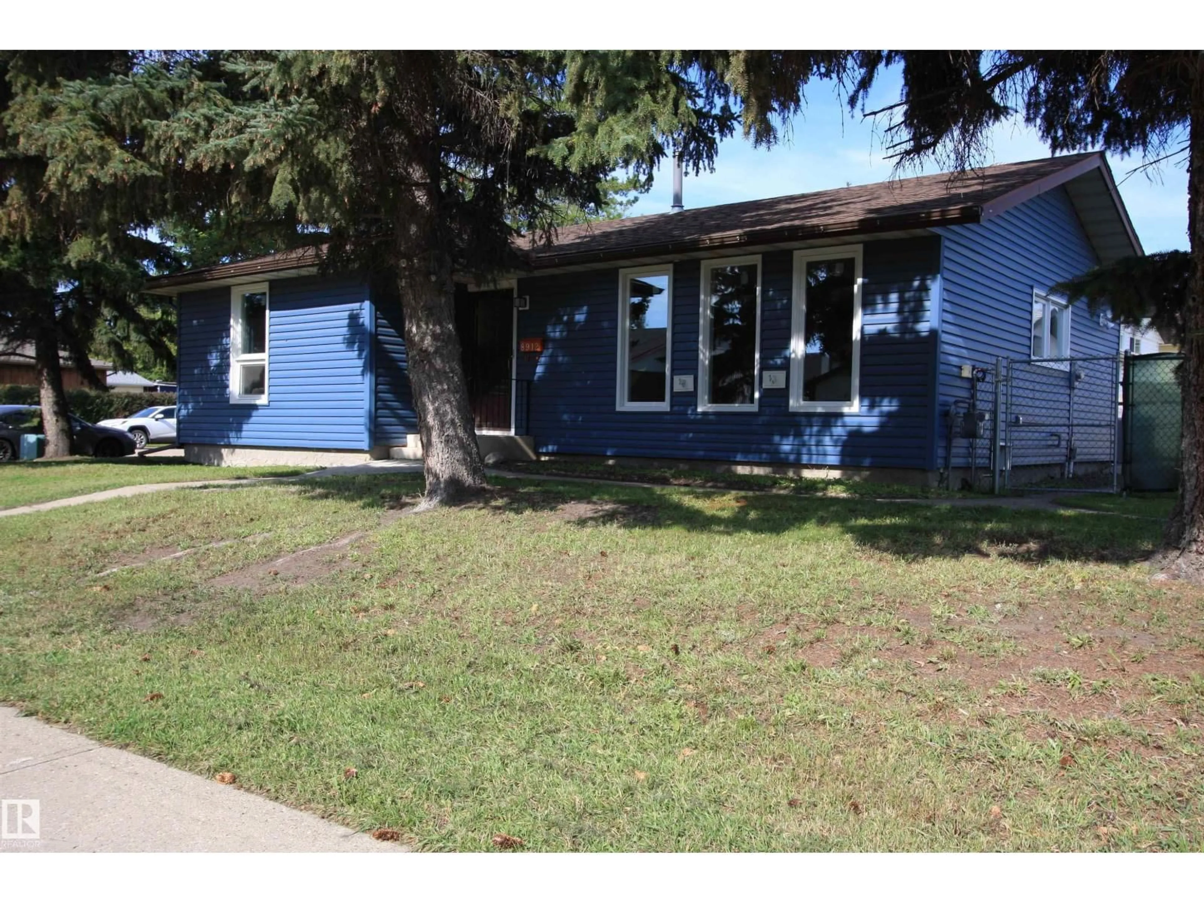 Home with vinyl exterior material, street for 8912 99 AV, Morinville Alberta T8R1K4