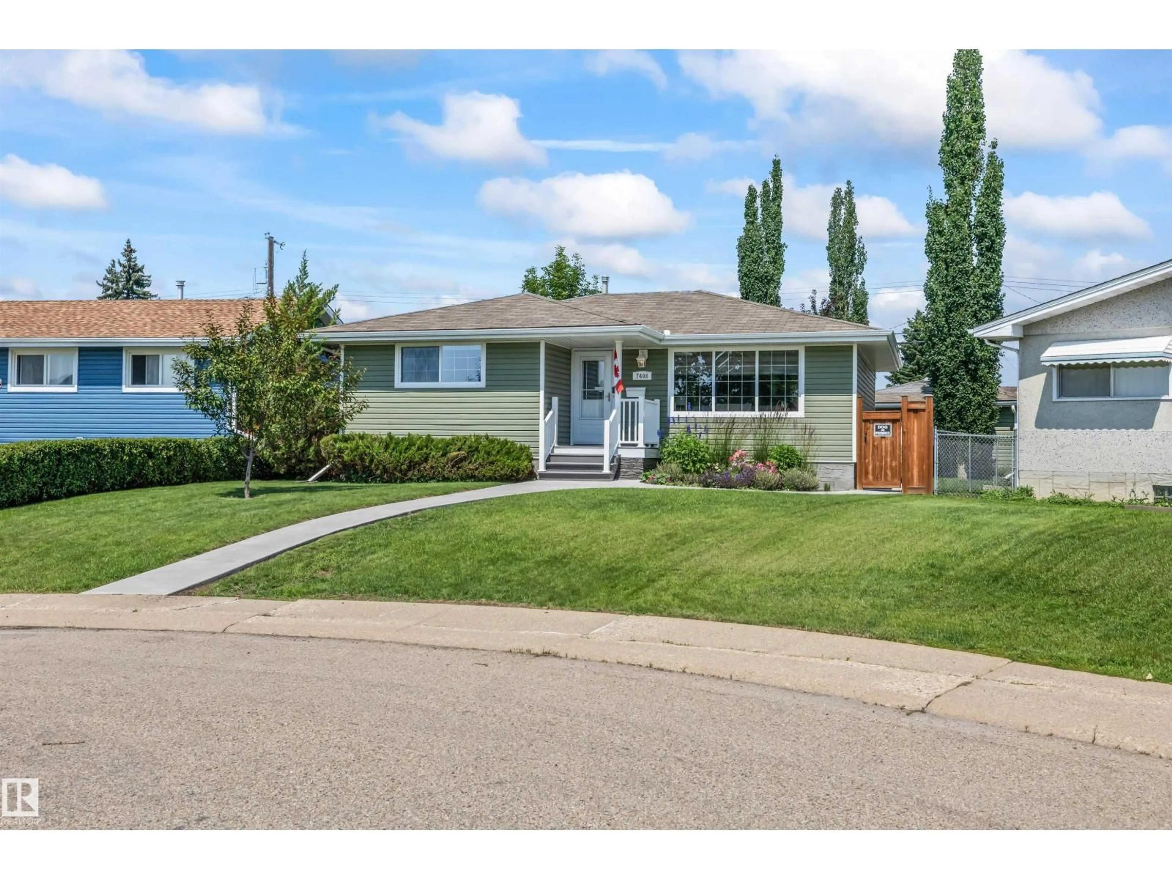 Home with vinyl exterior material, street for 7408 133 AV, Edmonton Alberta T5C2E4