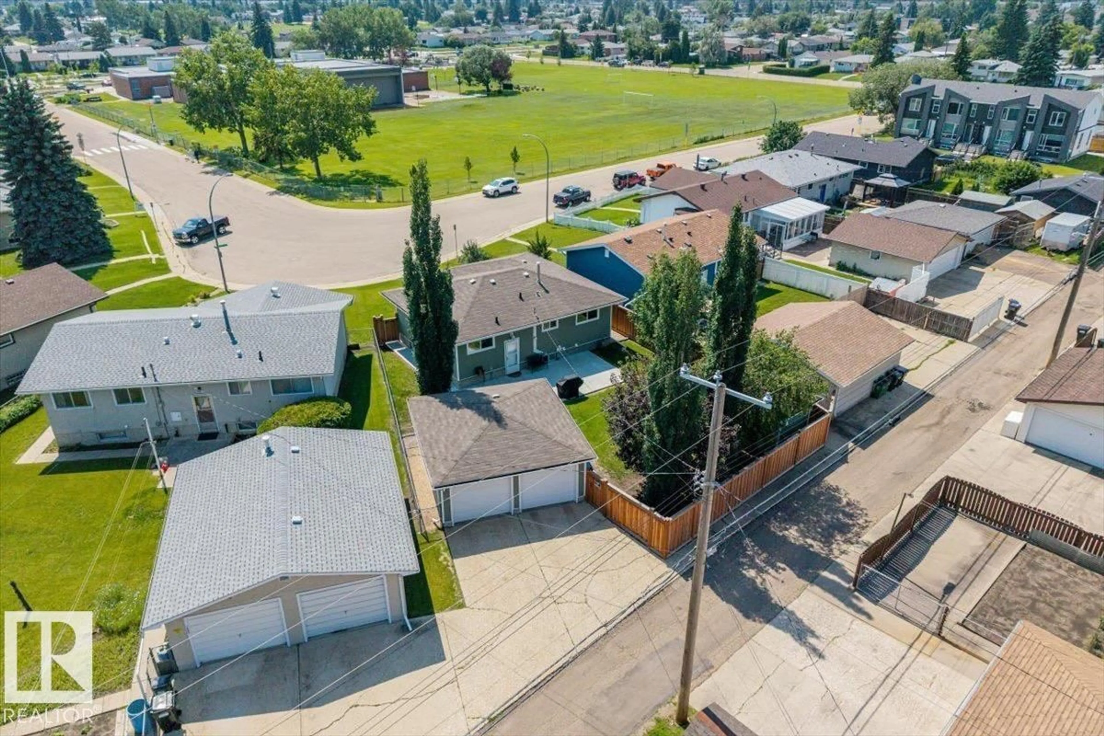 A pic from outside/outdoor area/front of a property/back of a property/a pic from drone, street for 7408 133 AV, Edmonton Alberta T5C2E4